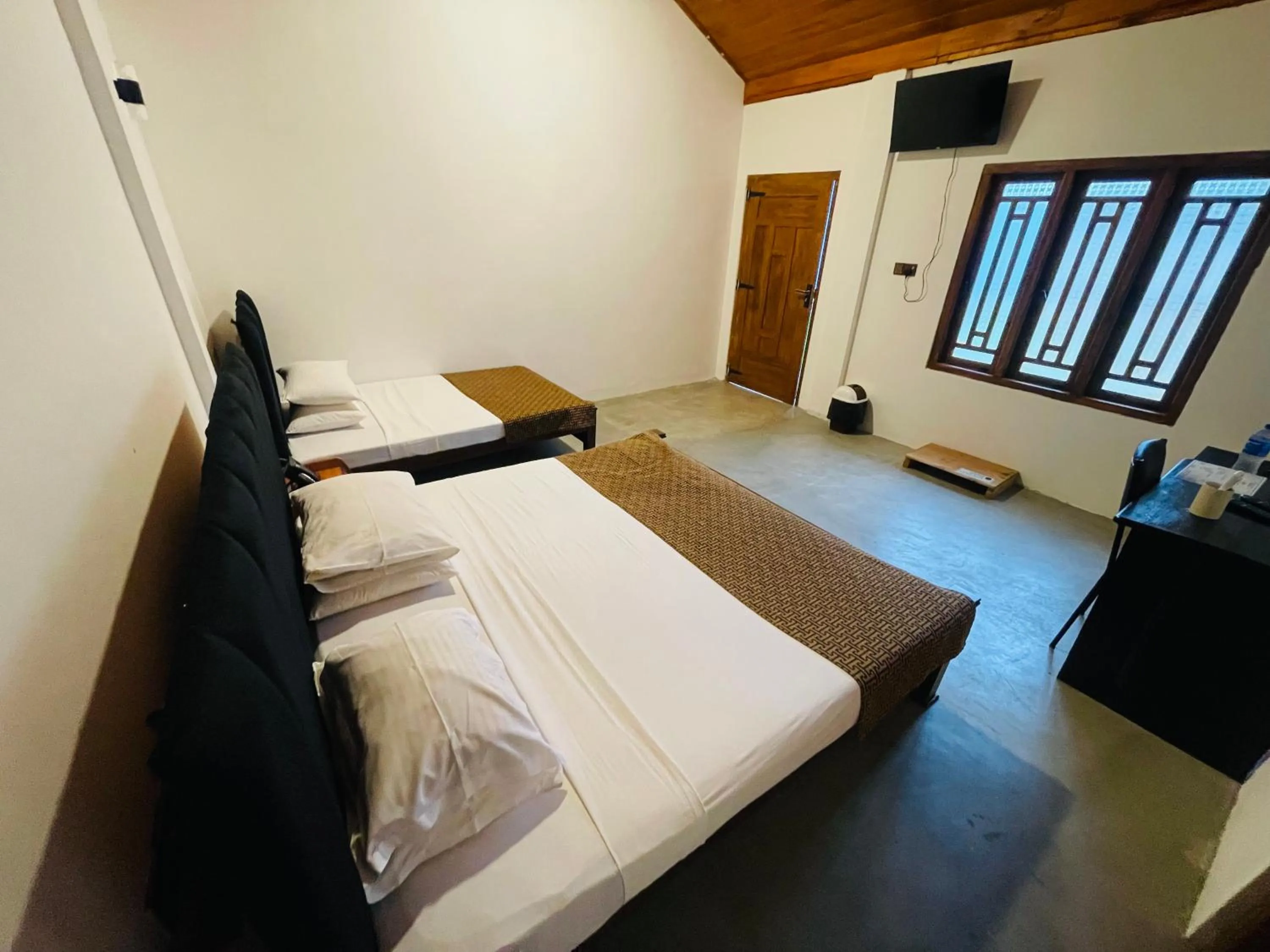 Bed in Nilaveli Hybrid Holiday Hotel