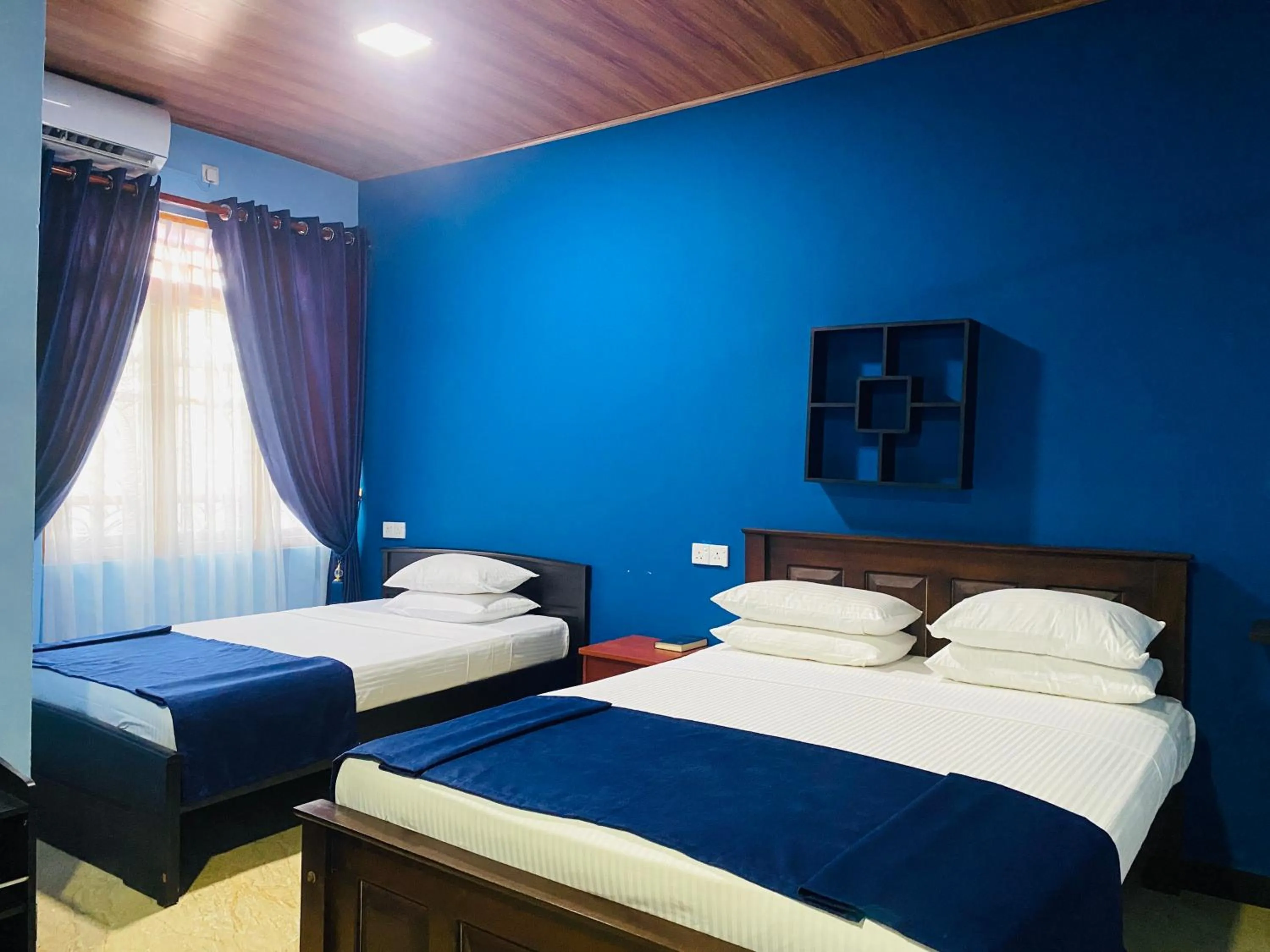 Bed in Nilaveli Hybrid Holiday Hotel