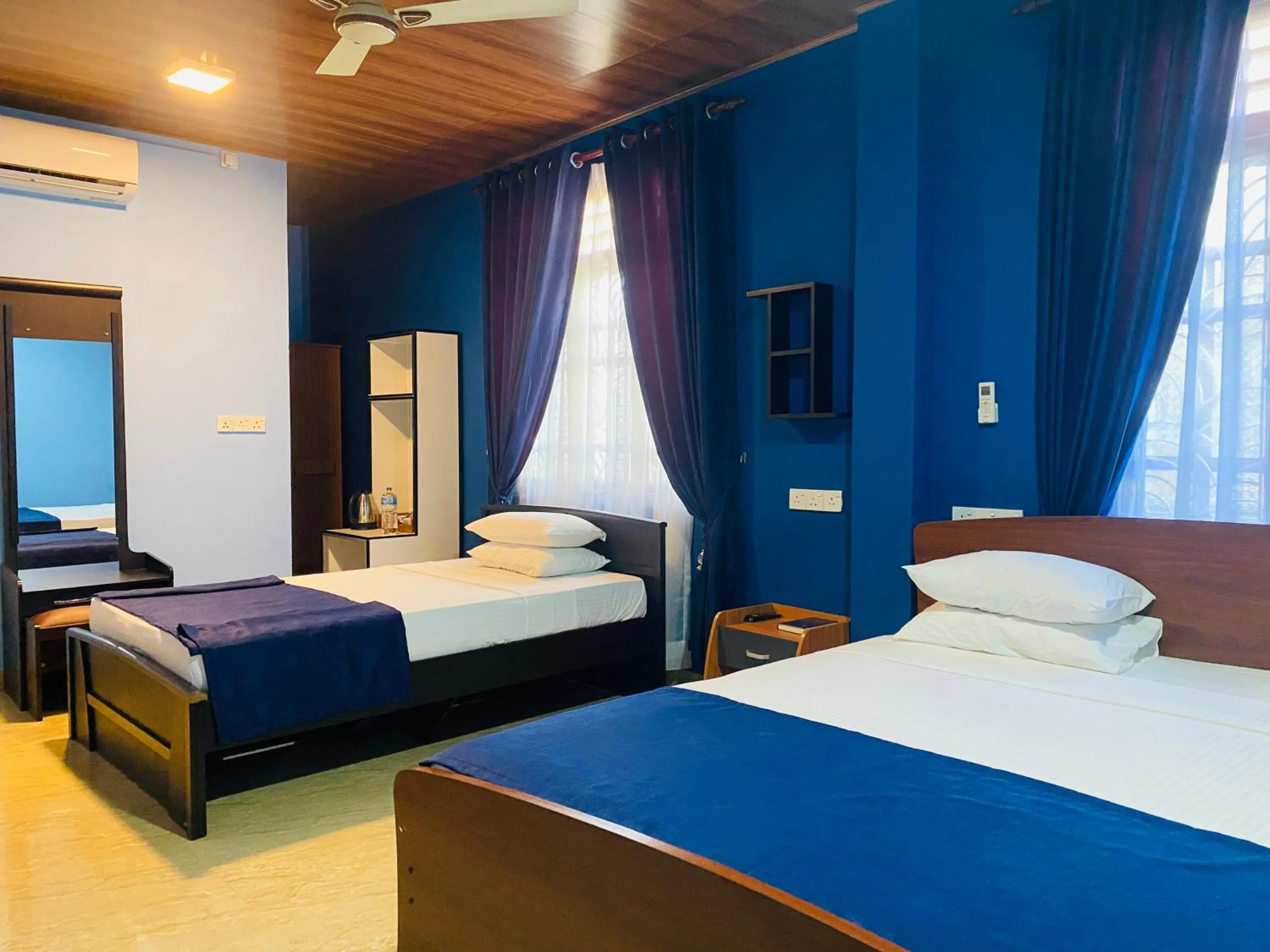 Bed in Nilaveli Hybrid Holiday Hotel