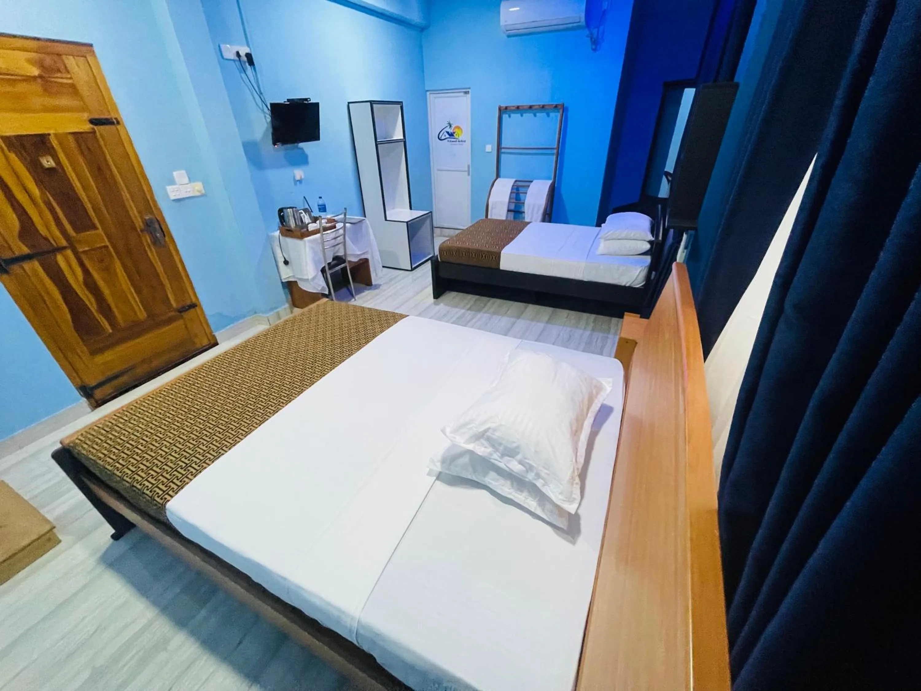 Bed in Nilaveli Hybrid Holiday Hotel