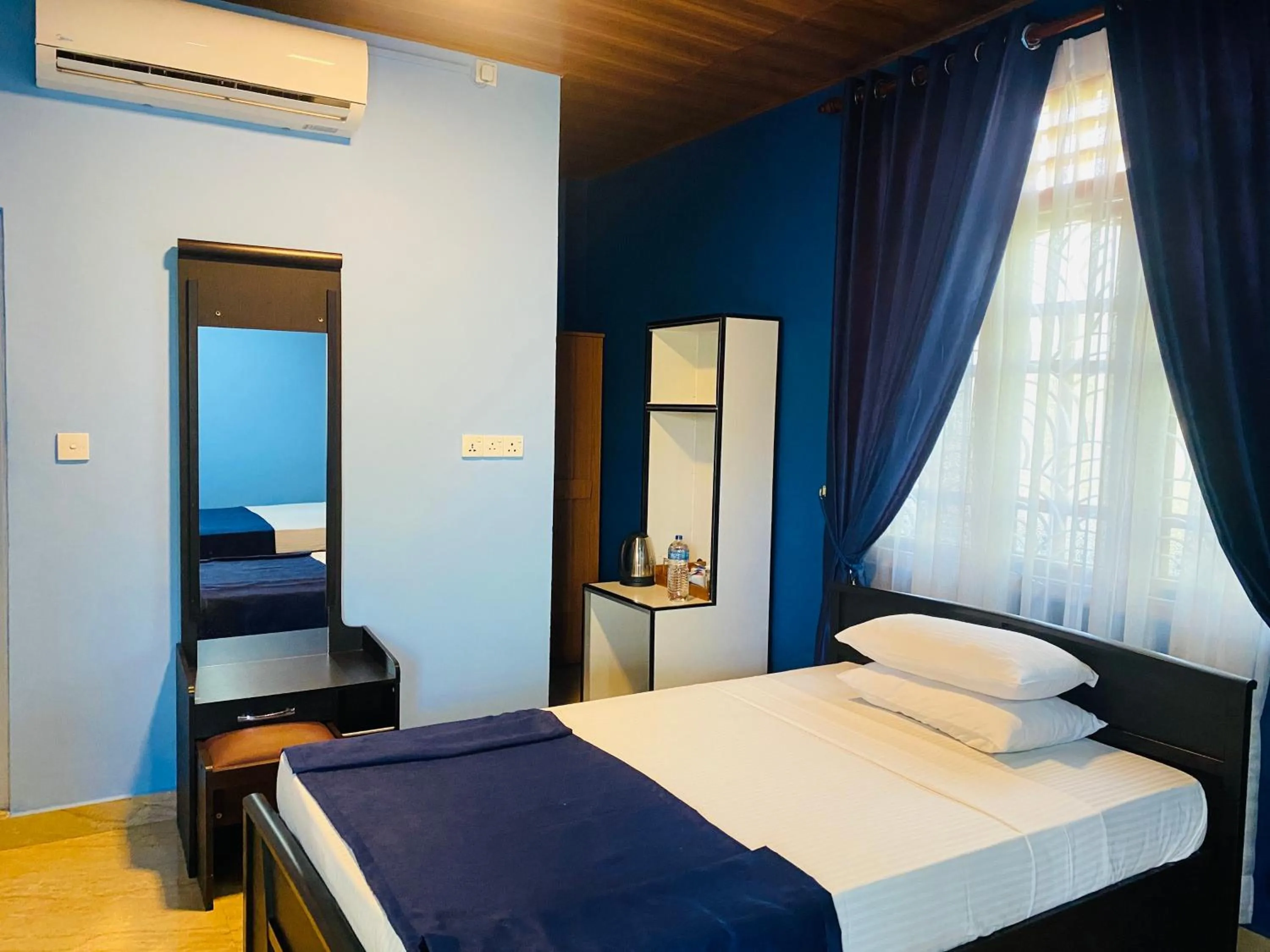 Bed in Nilaveli Hybrid Holiday Hotel