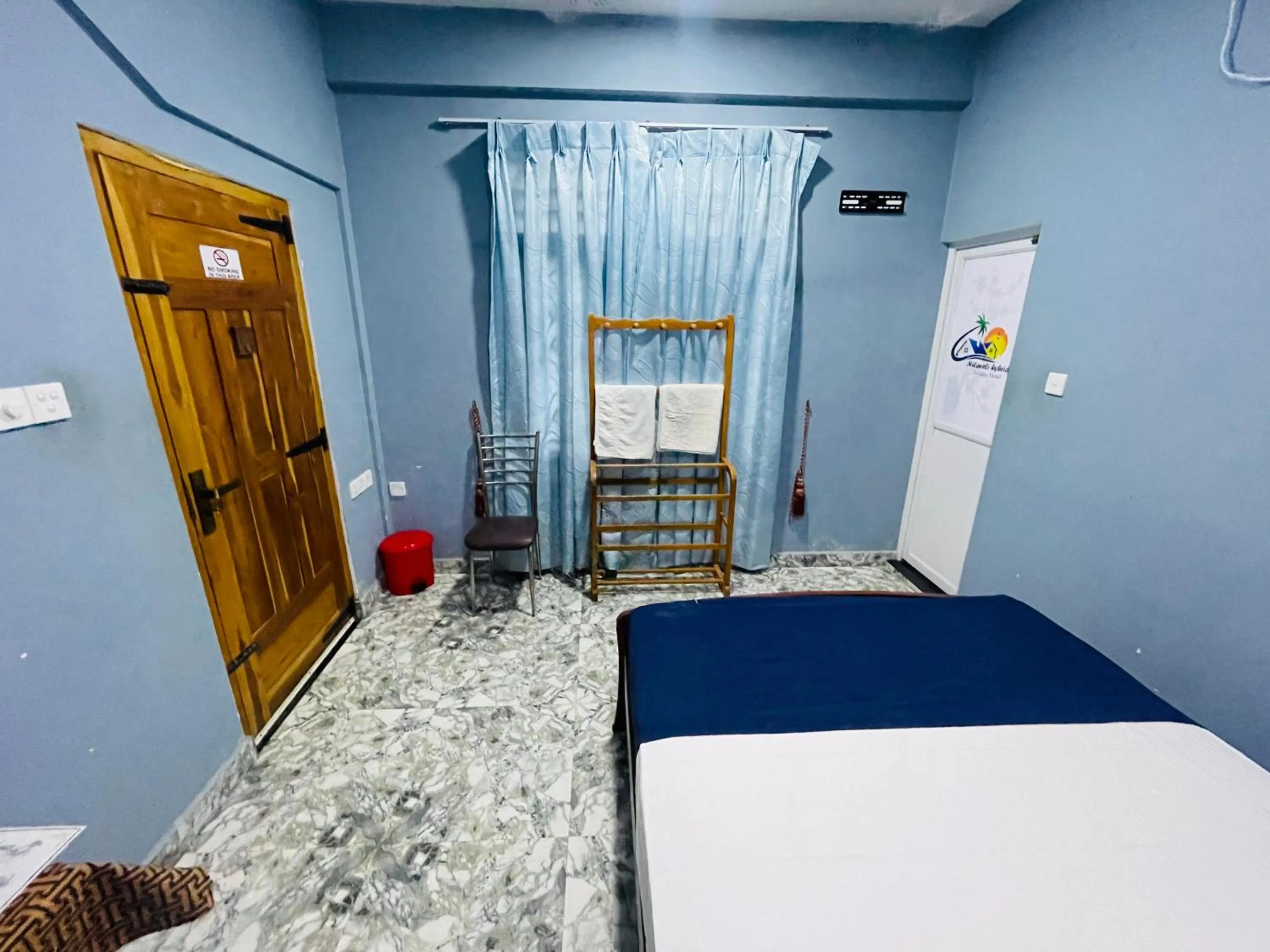 Bed in Nilaveli Hybrid Holiday Hotel