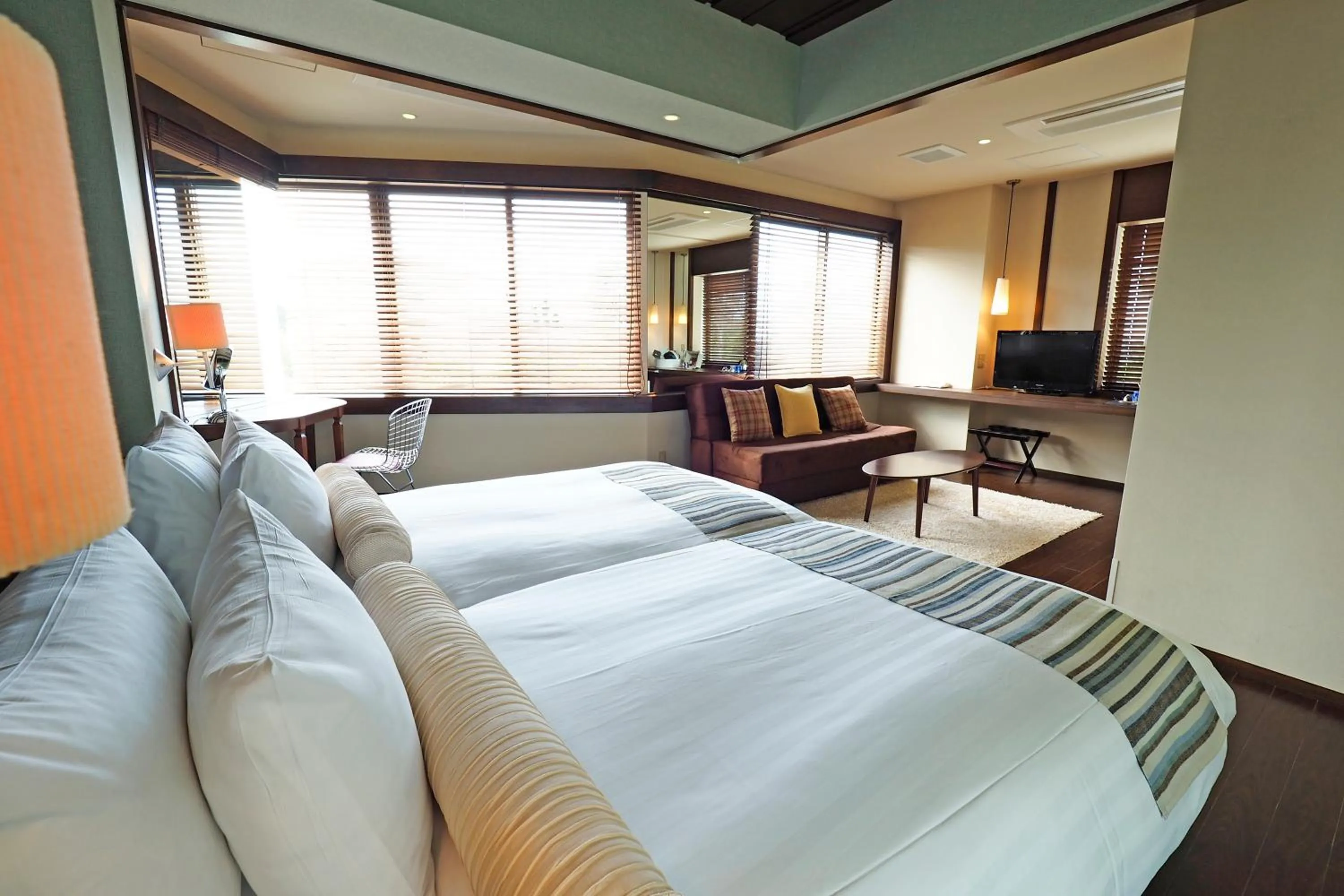 Bed in La Casa Panacea Okinawa Resort