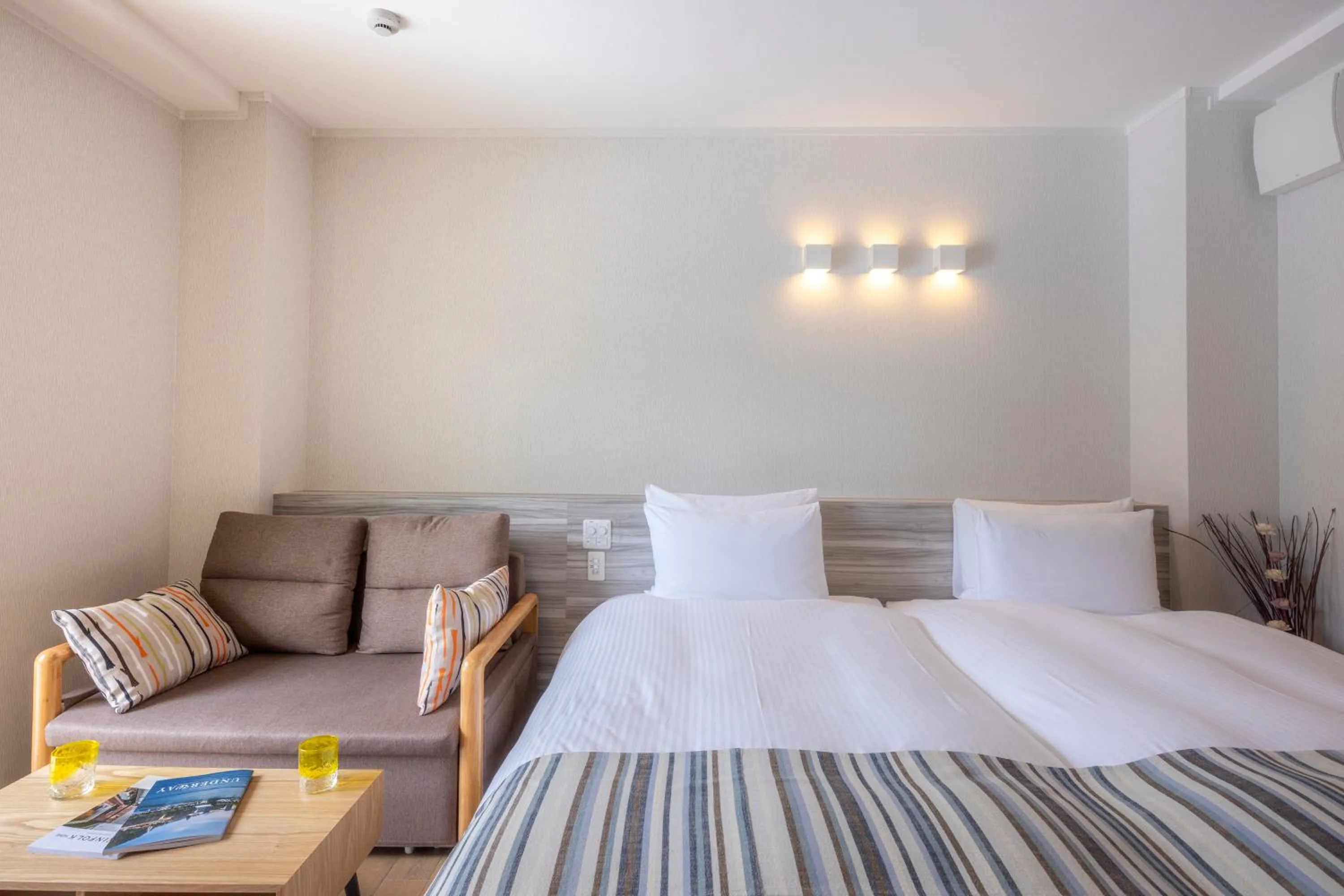 Bed in La Casa Panacea Okinawa Resort