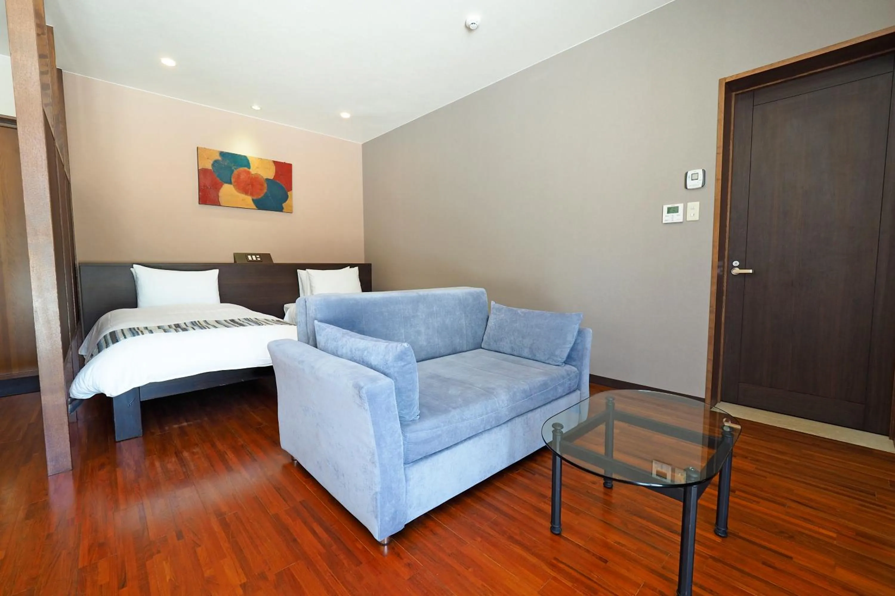 Bed in La Casa Panacea Okinawa Resort