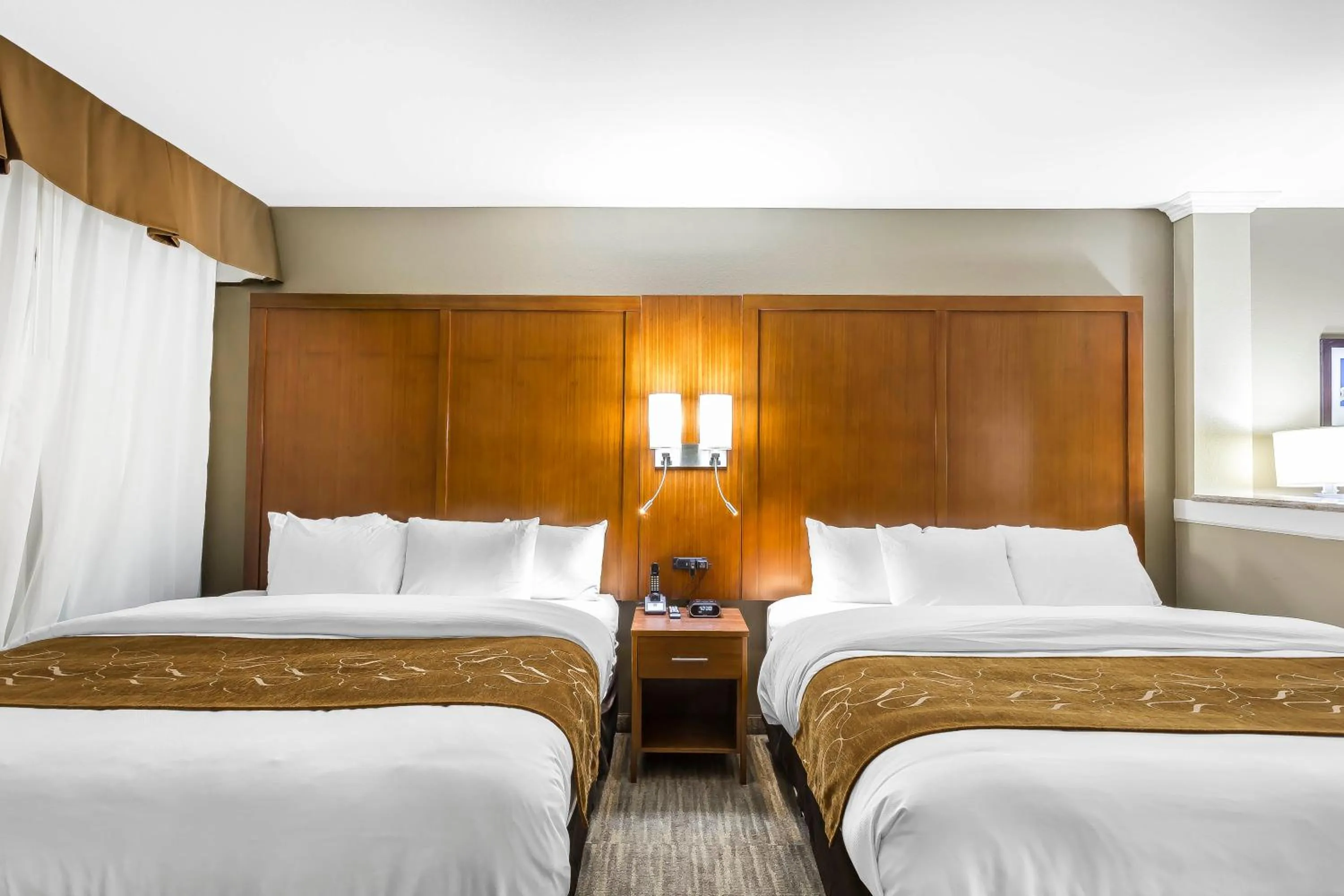 Bed in Comfort Suites - University