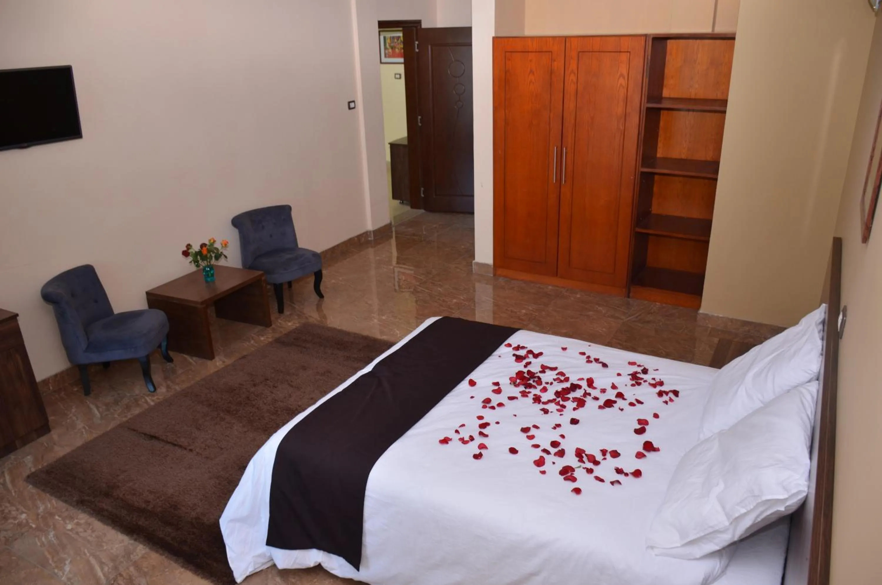 Seating area, Bed in Melodie Hotel