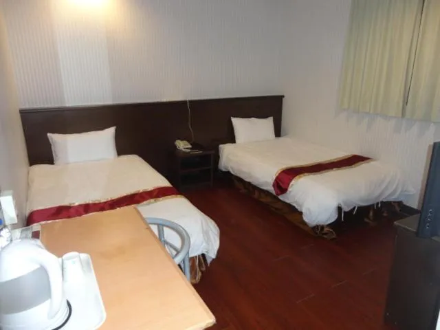 Bed in Yi Pin Yuan Hotel