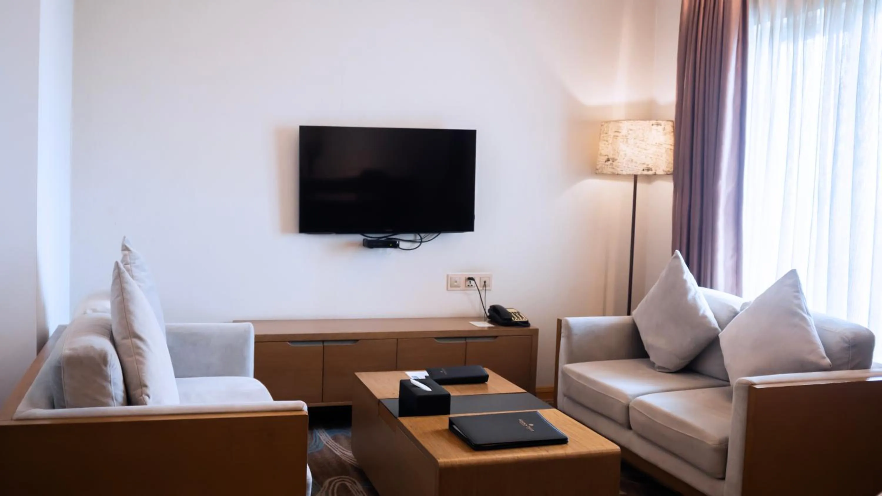 Communal lounge/ TV room in Hotel The Grandmark-Dhaka