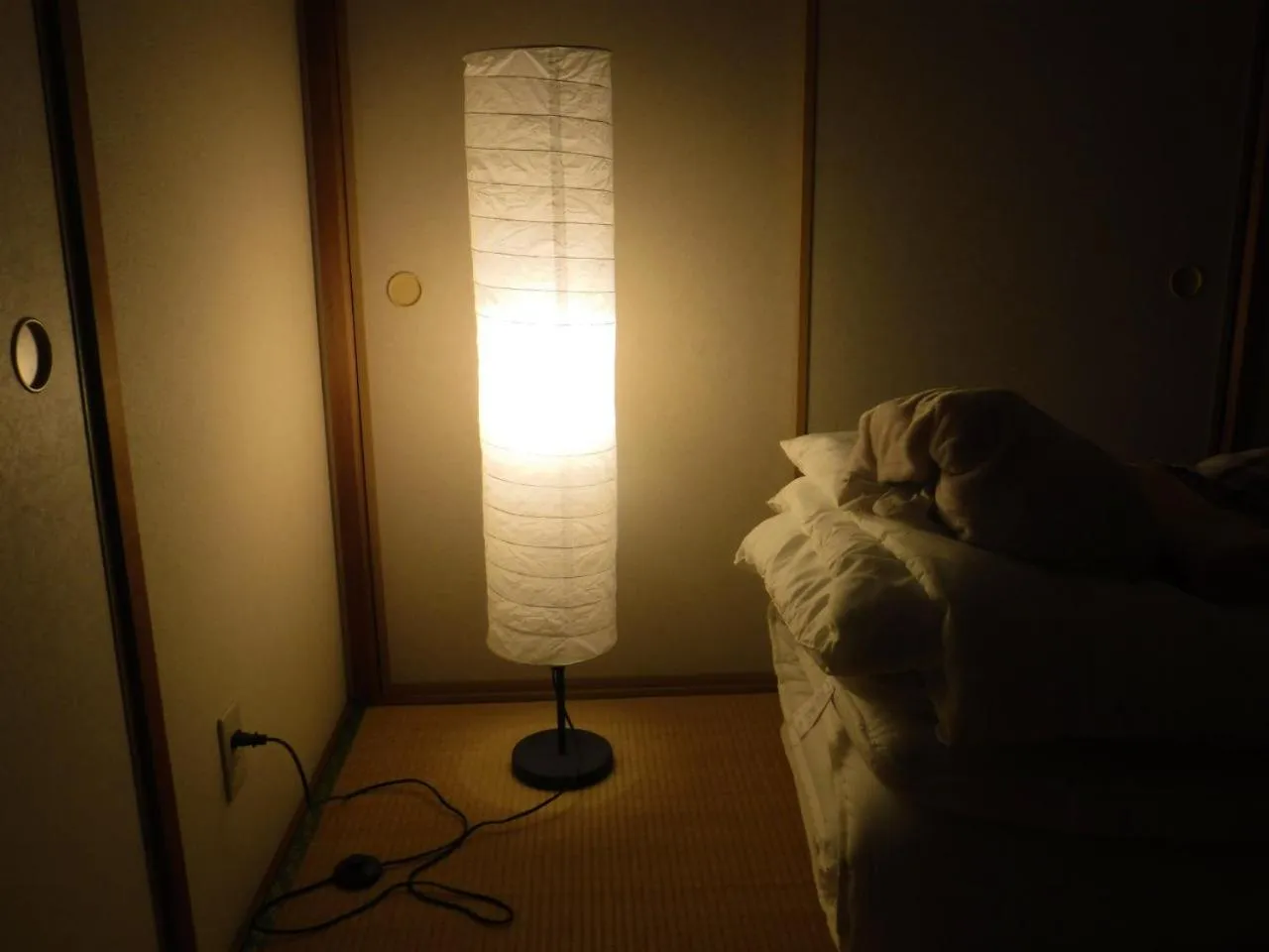 Bed in Wholeearth Ryokan Hiroshima