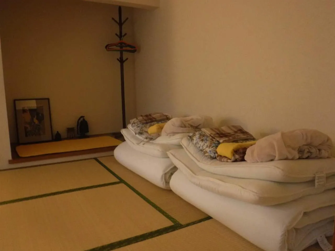 Bed in Wholeearth Ryokan Hiroshima