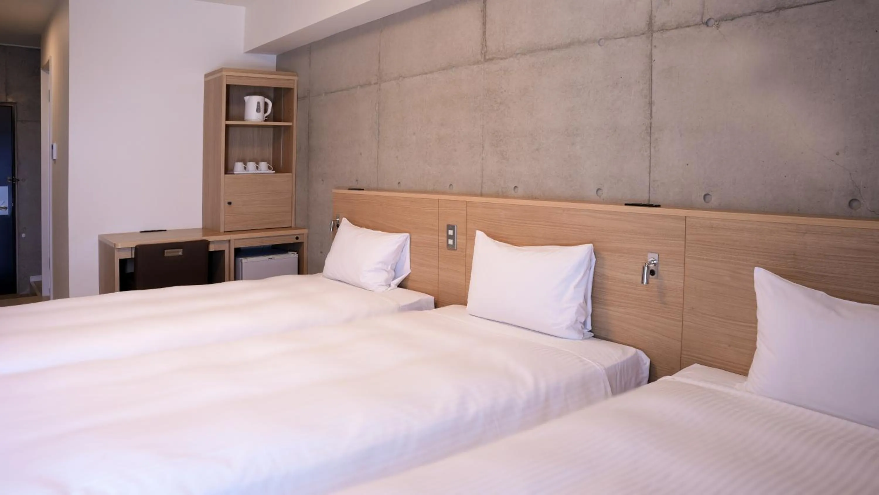 Bed in The BREAKFAST HOTEL PORTO Ishigakijima