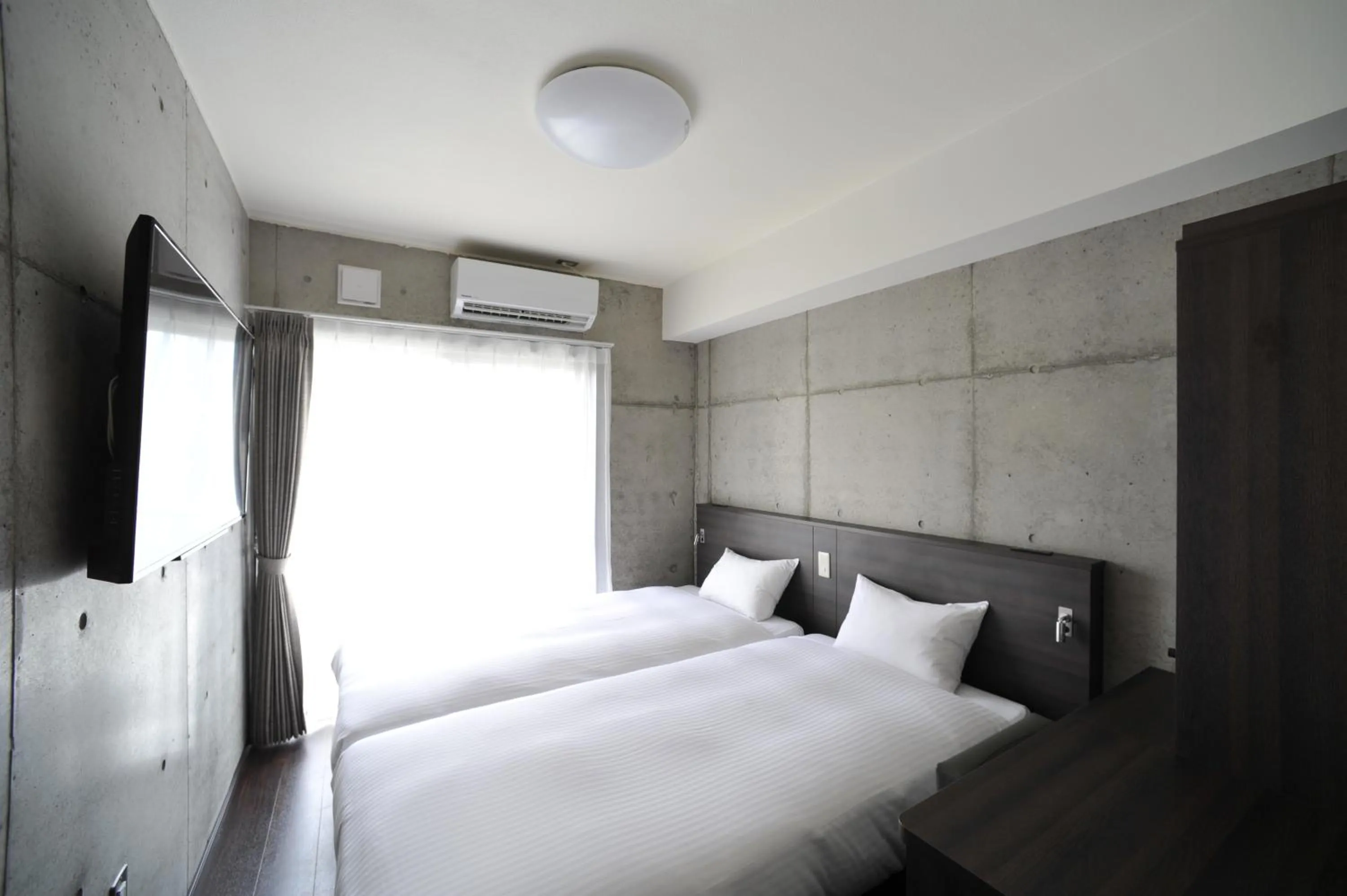 Bed in The BREAKFAST HOTEL PORTO Ishigakijima