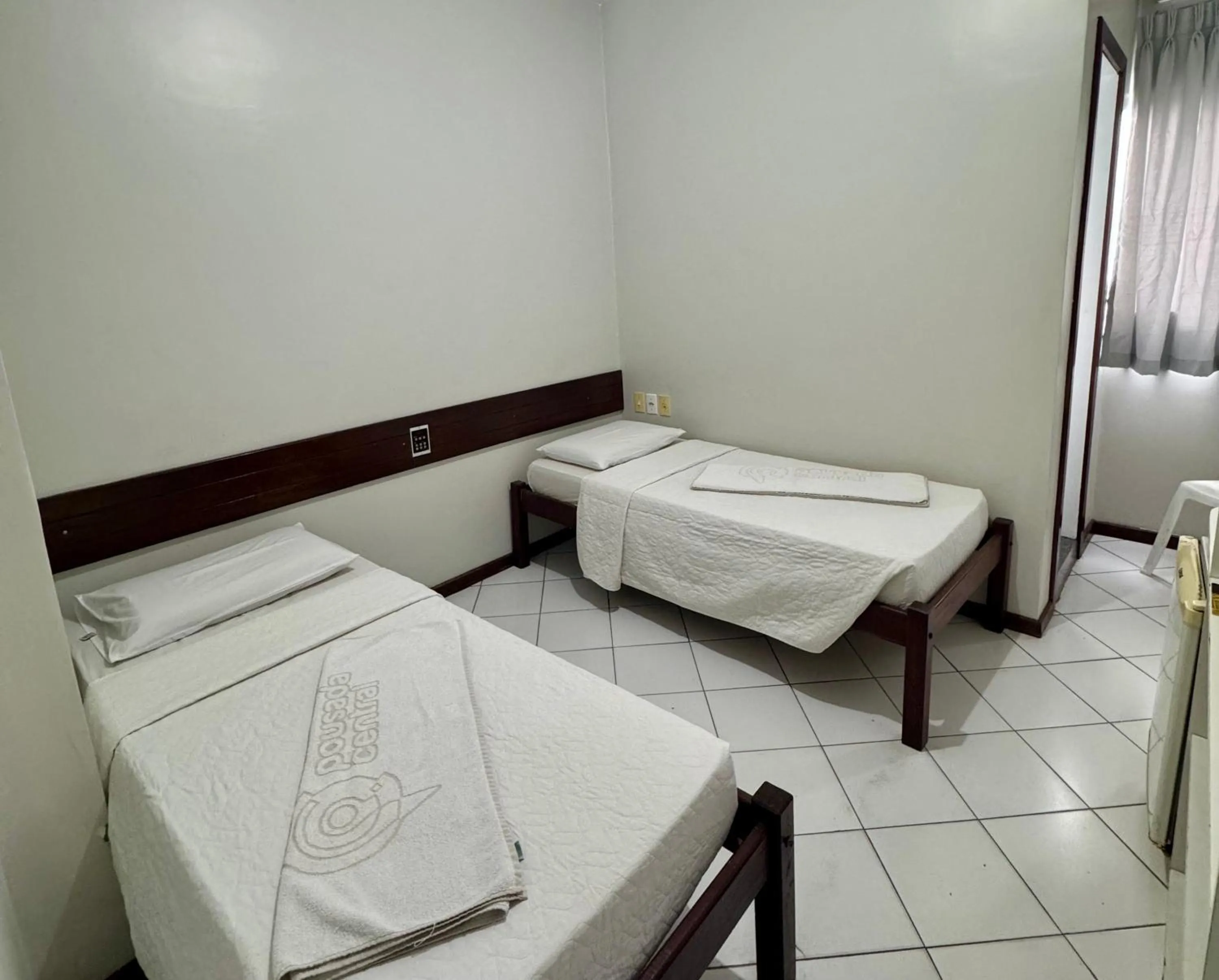 Bed in Pousada Central