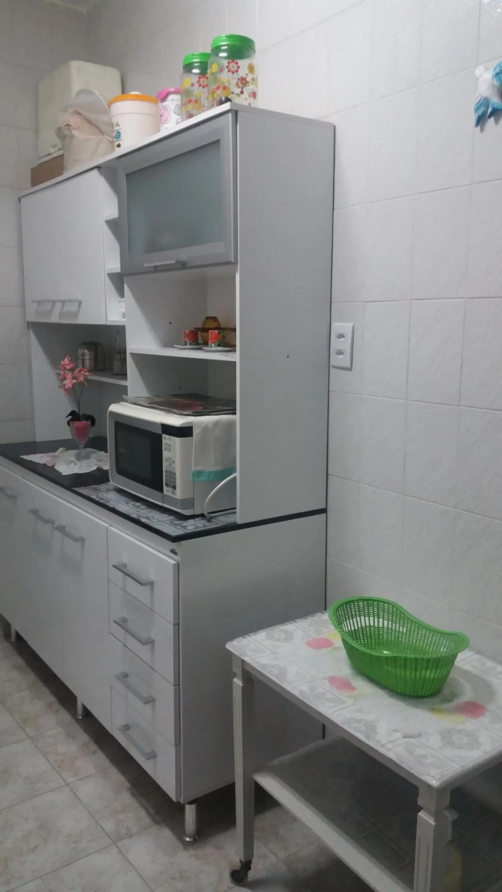 Communal kitchen in Apartamento Aconchego da vovó