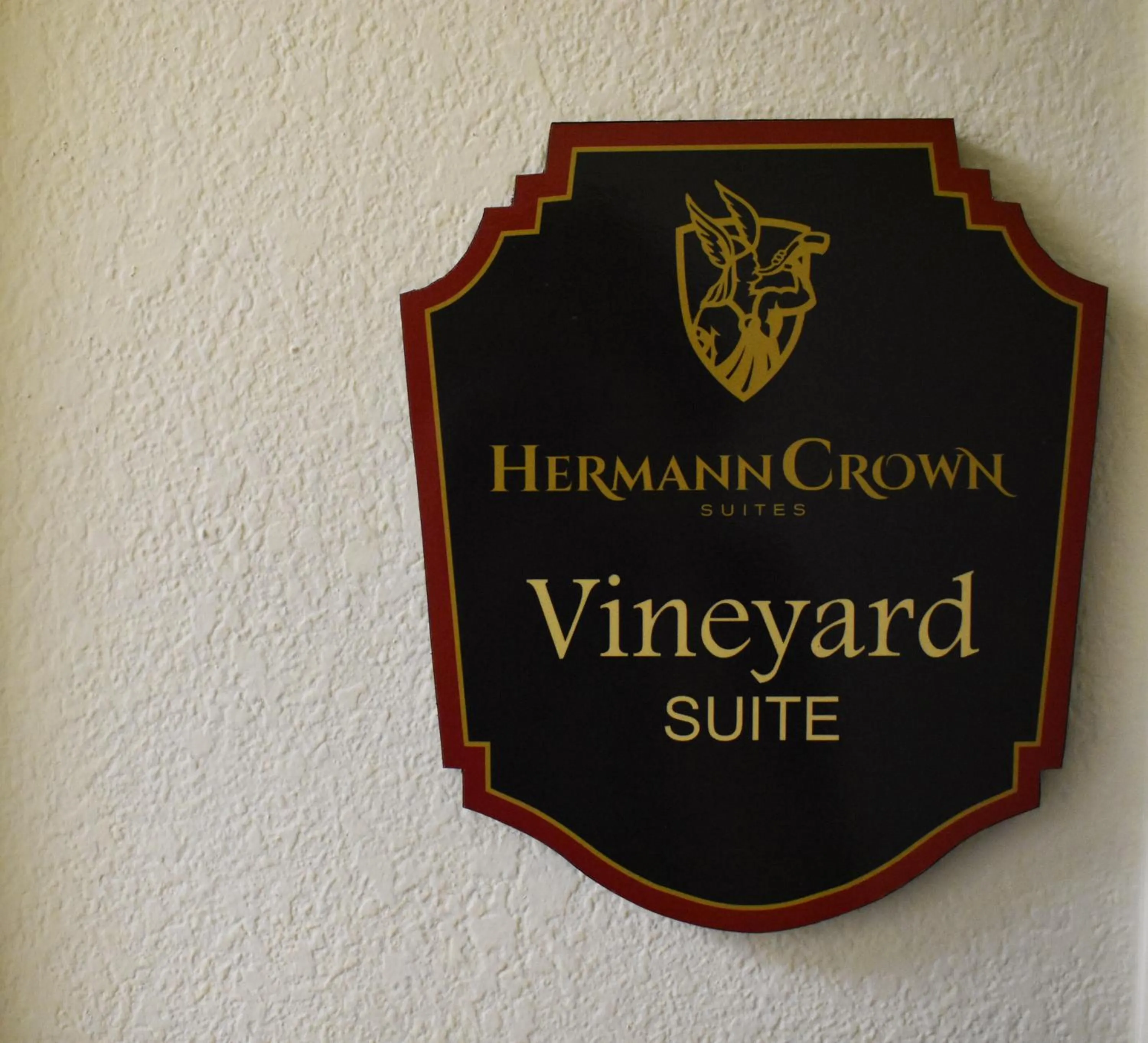 Property logo or sign in Hermann Crown Suites