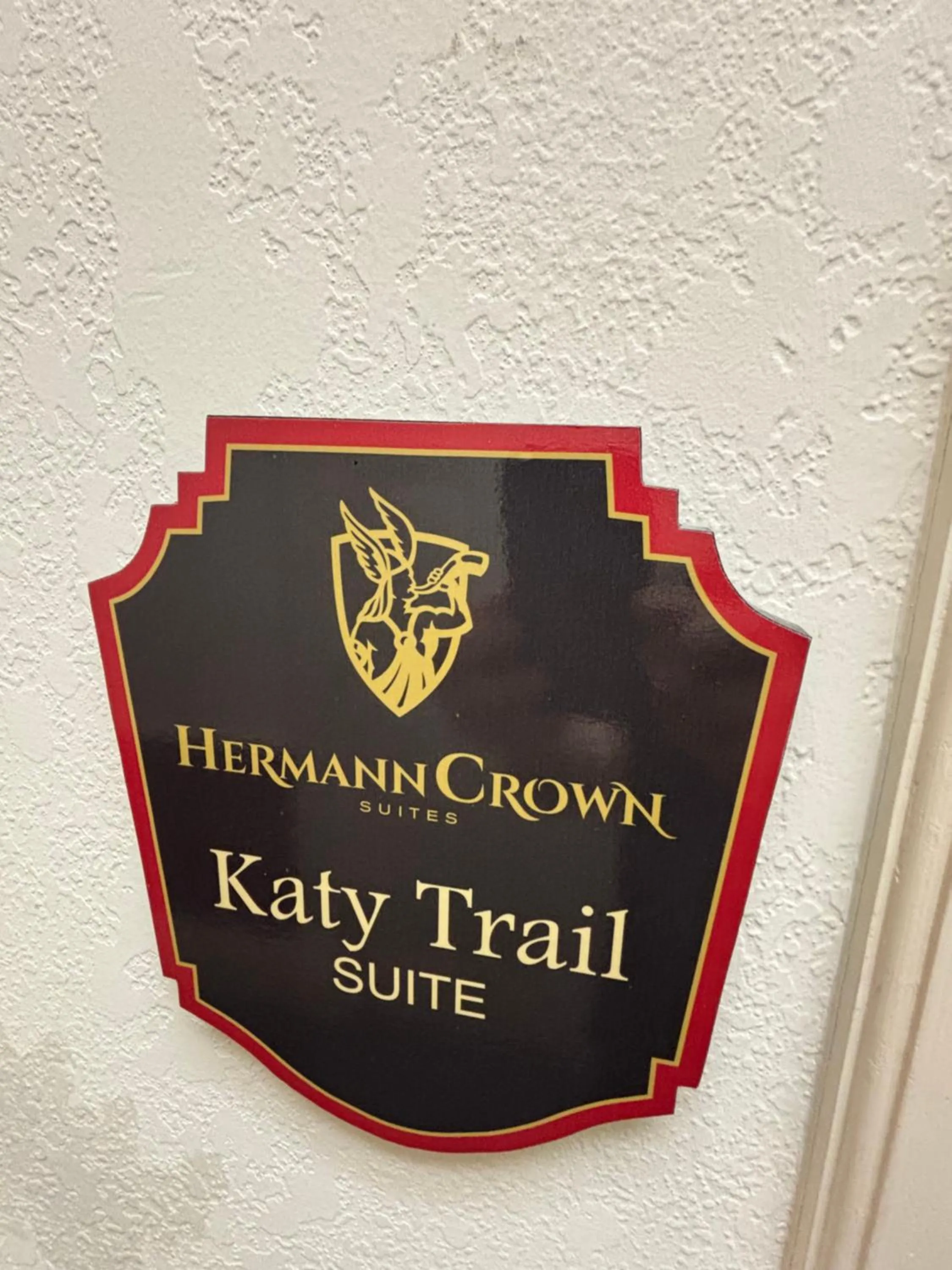 Property logo or sign in Hermann Crown Suites