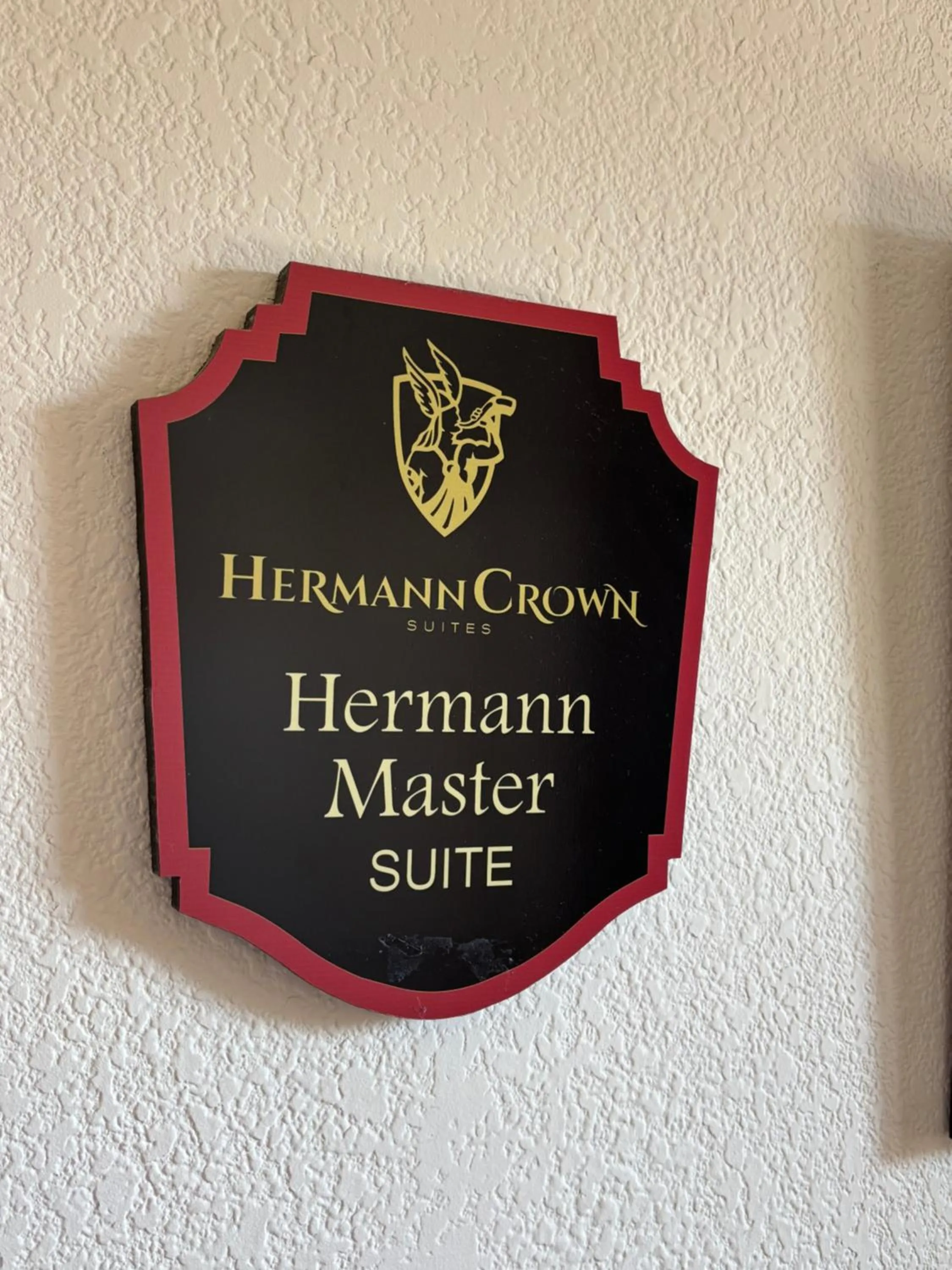 Property logo or sign in Hermann Crown Suites