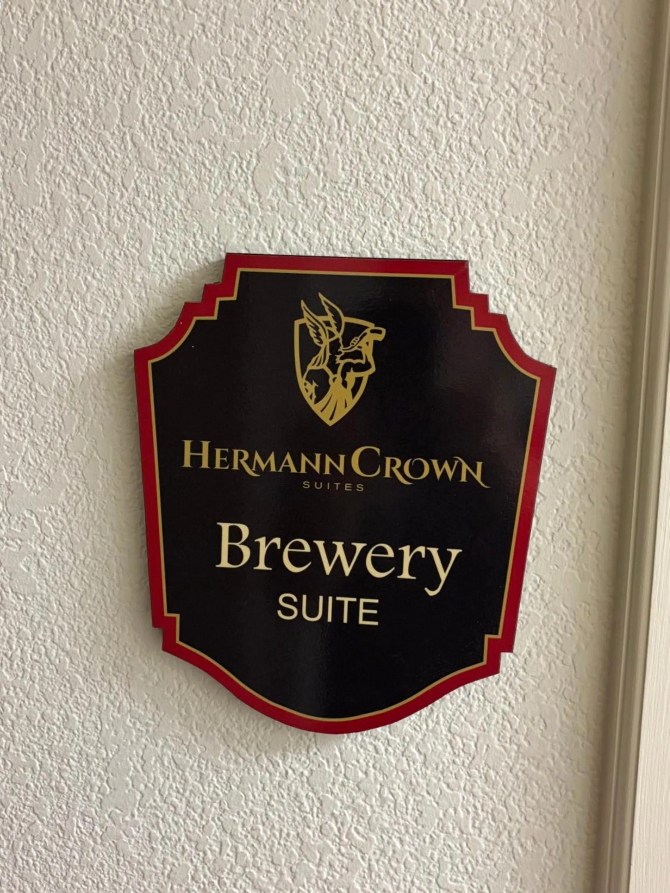 Property logo or sign in Hermann Crown Suites