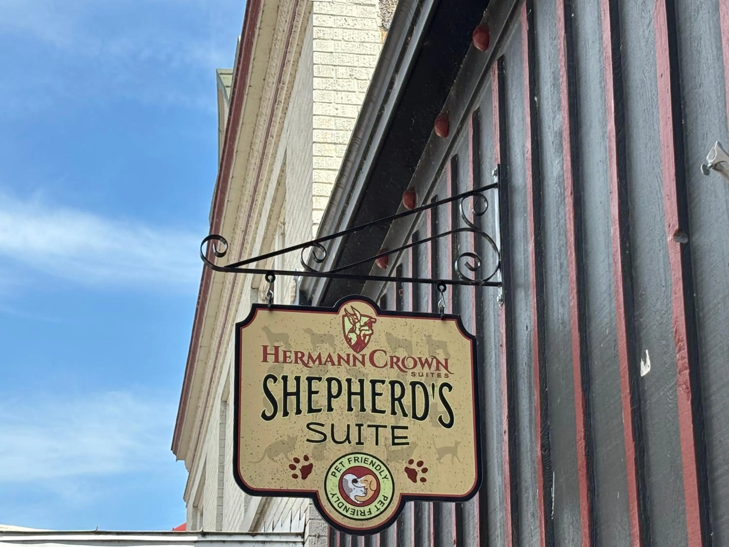 Property logo or sign in Hermann Crown Suites