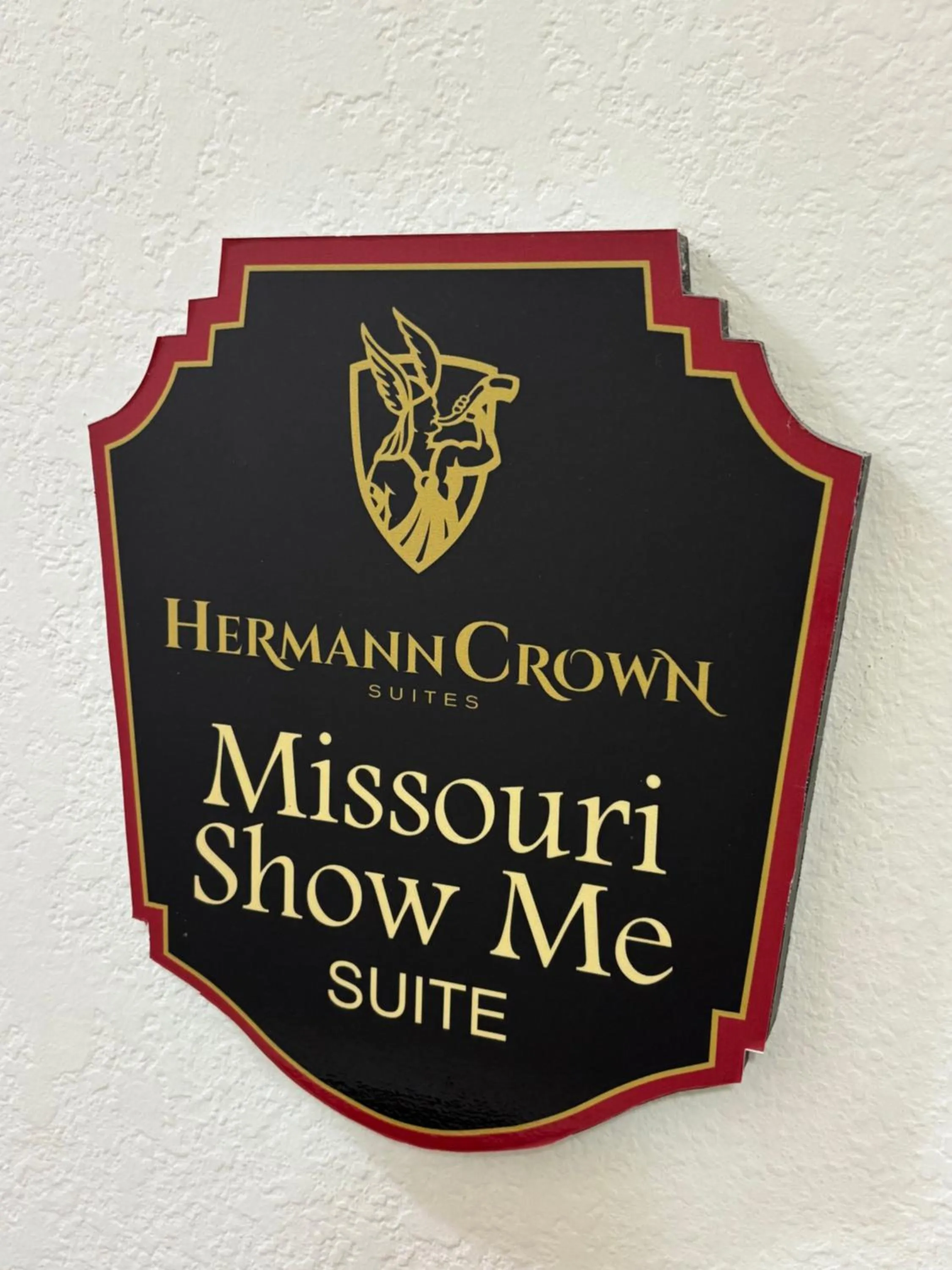 Property logo or sign in Hermann Crown Suites