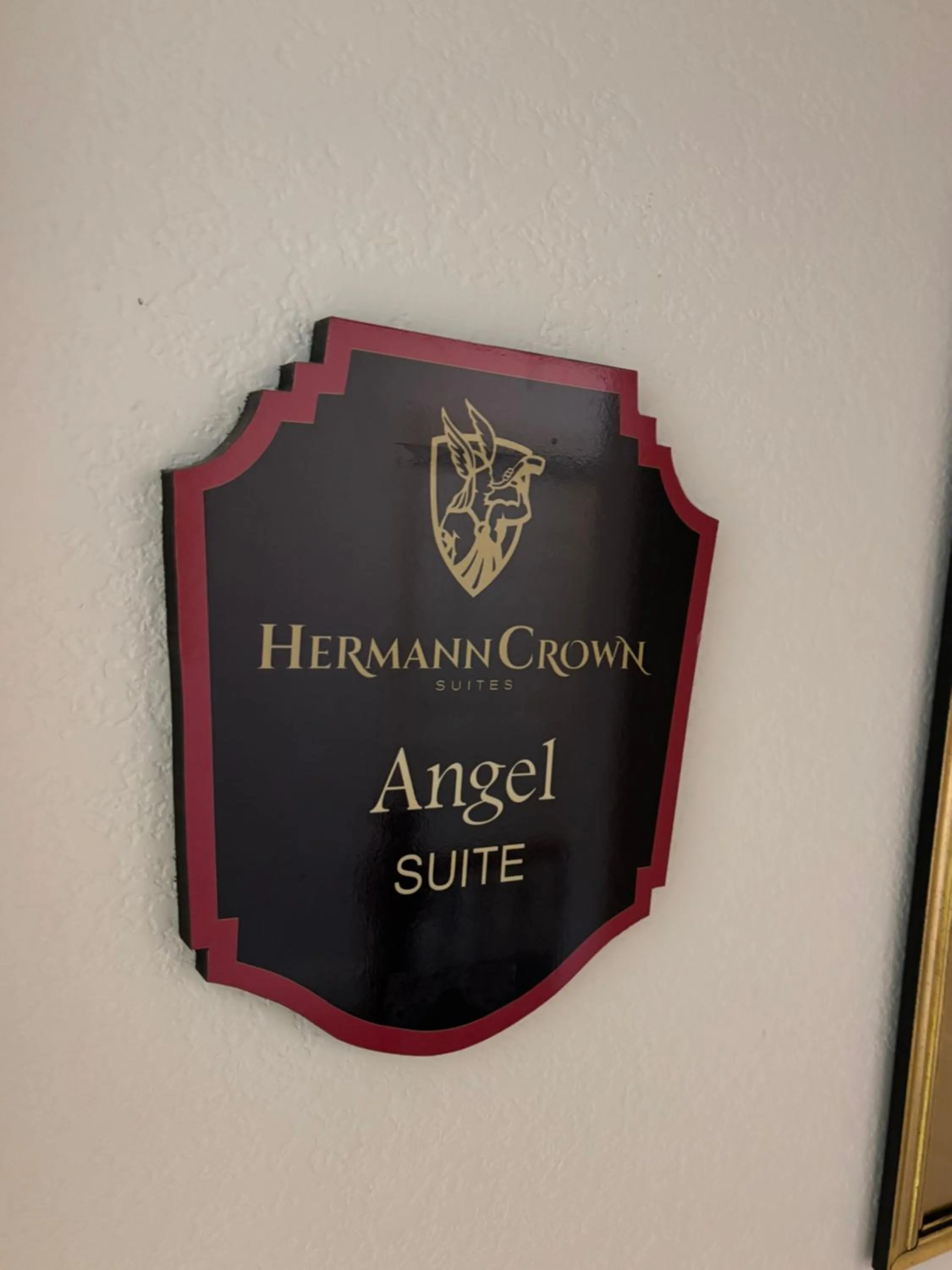Property logo or sign in Hermann Crown Suites