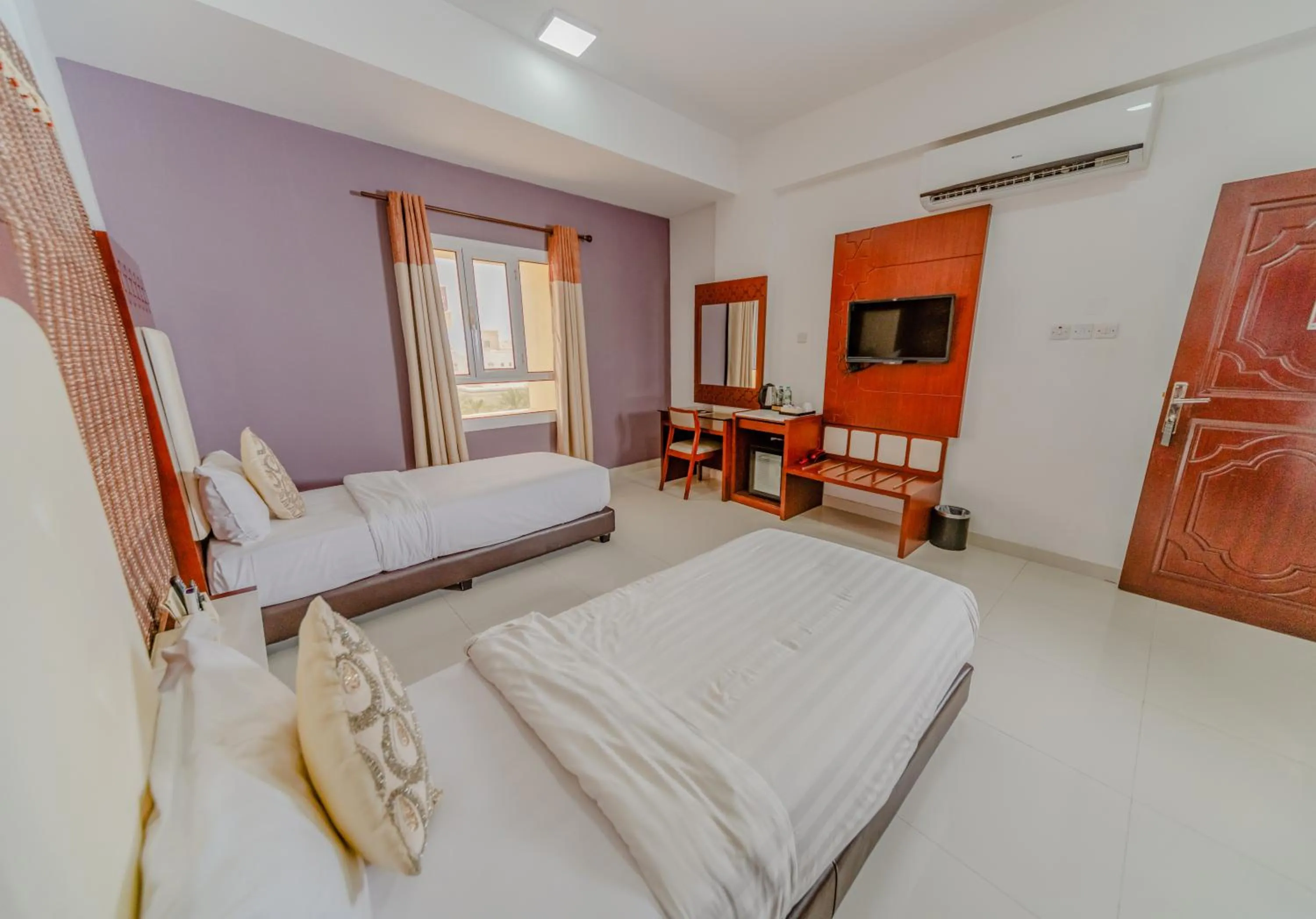 Bed in Zaki Hotel Apartment