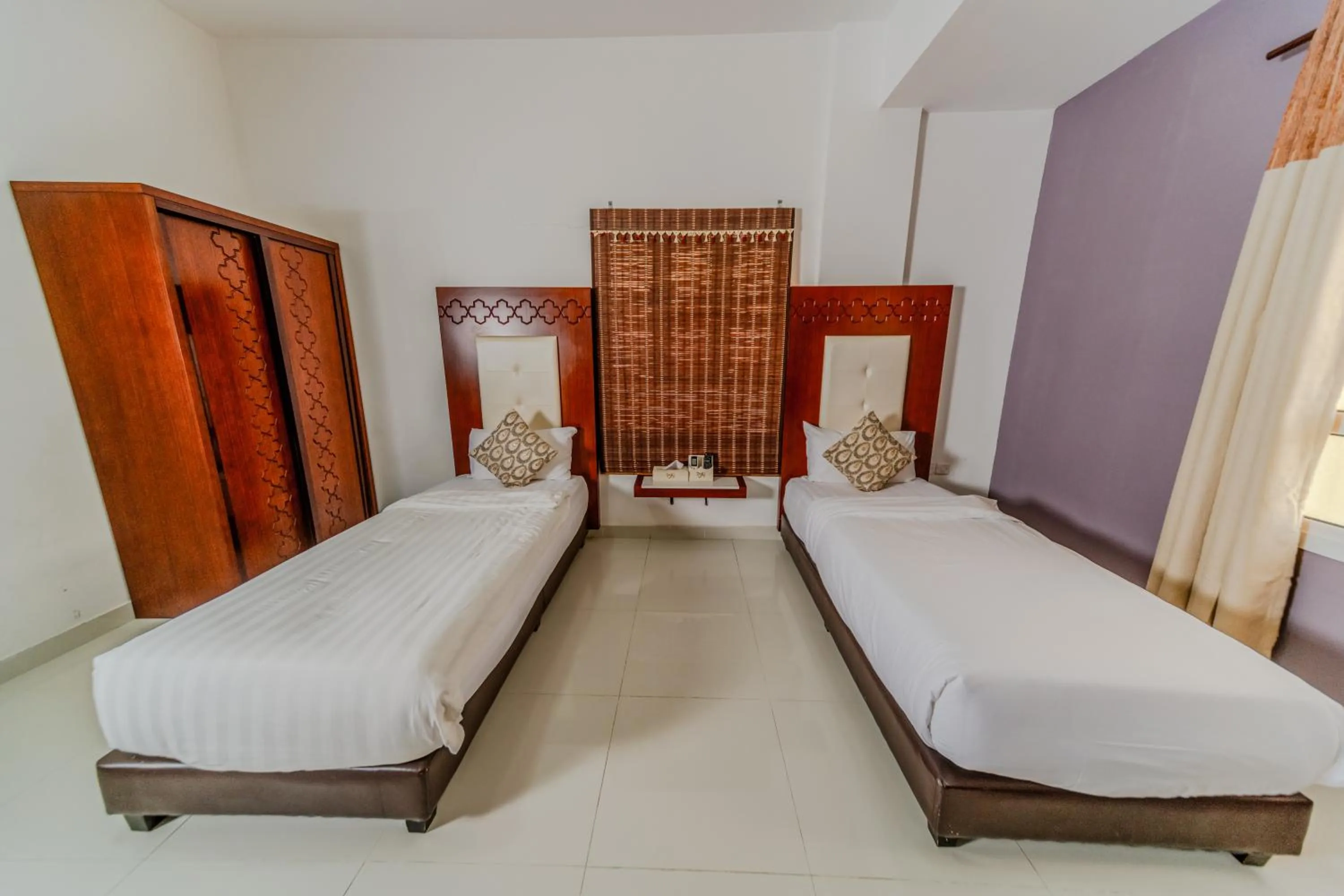 Bed in Zaki Hotel Apartment