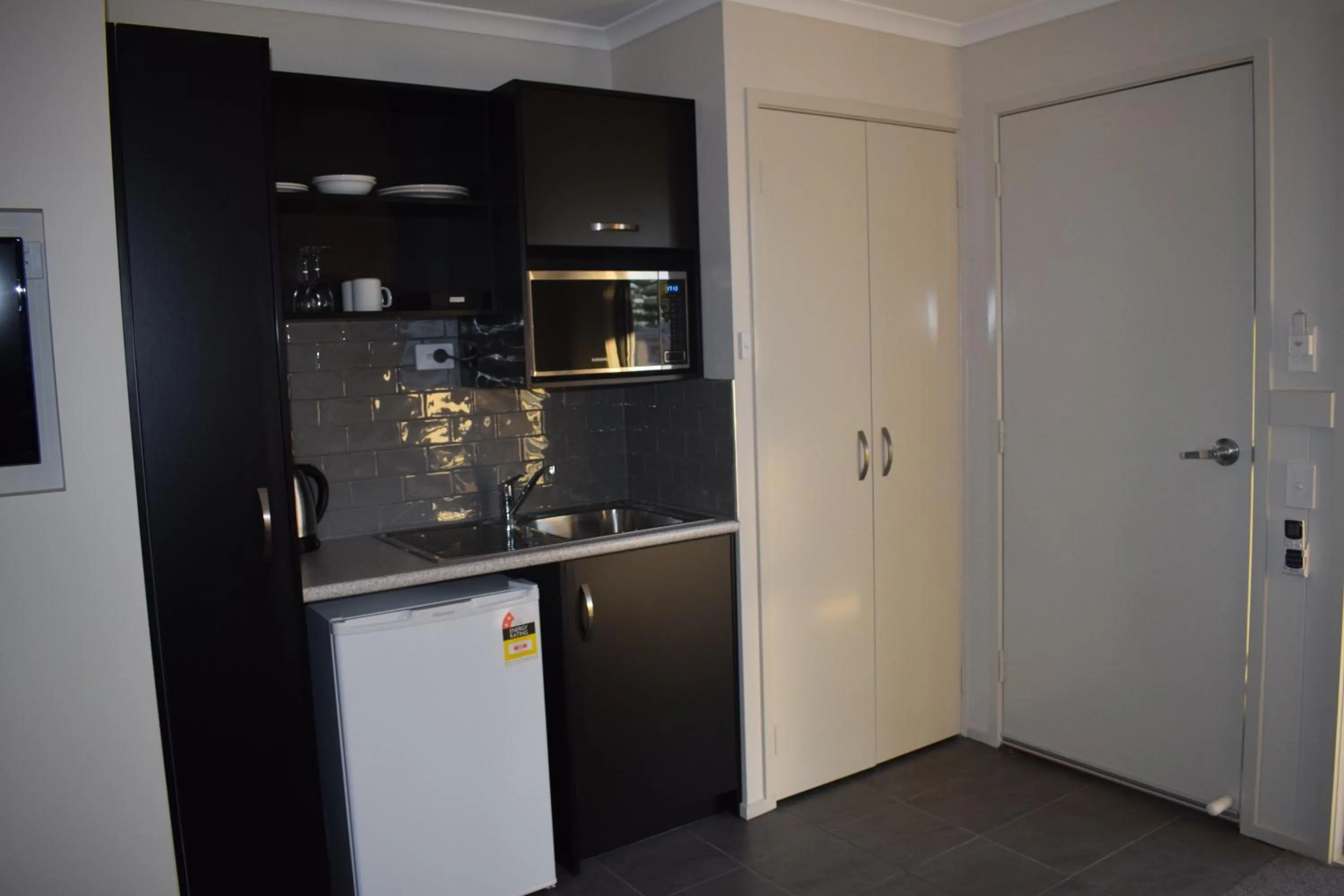 Kitchen or kitchenette in NRMA Port Macquarie Breakwall Holiday Park