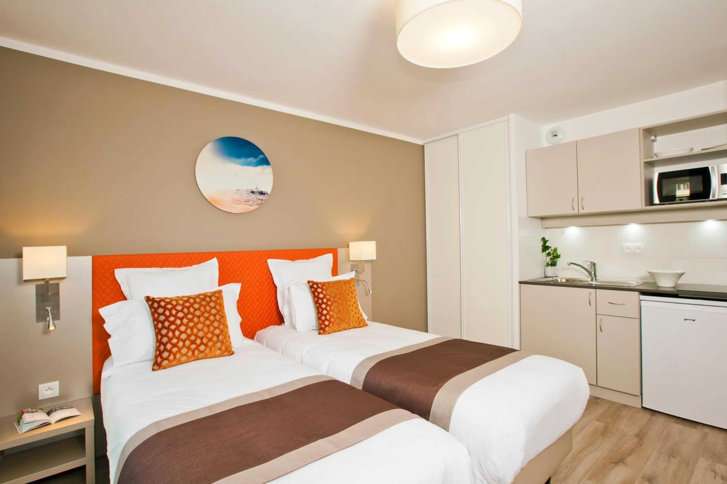 Kitchen or kitchenette, Bed in Residhome Paris Rosa Parks