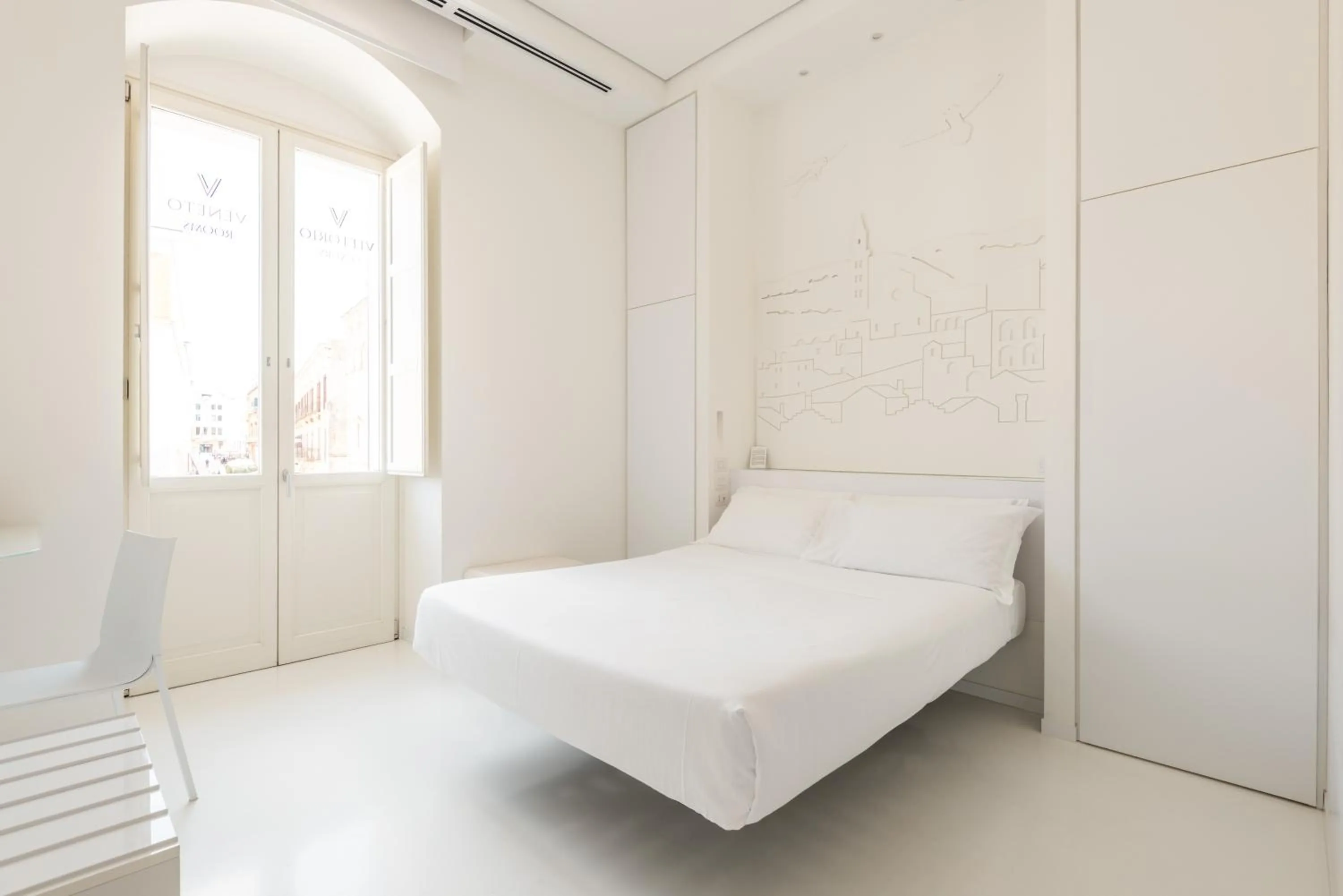Bed in Vittorio Veneto Matera Luxury Rooms
