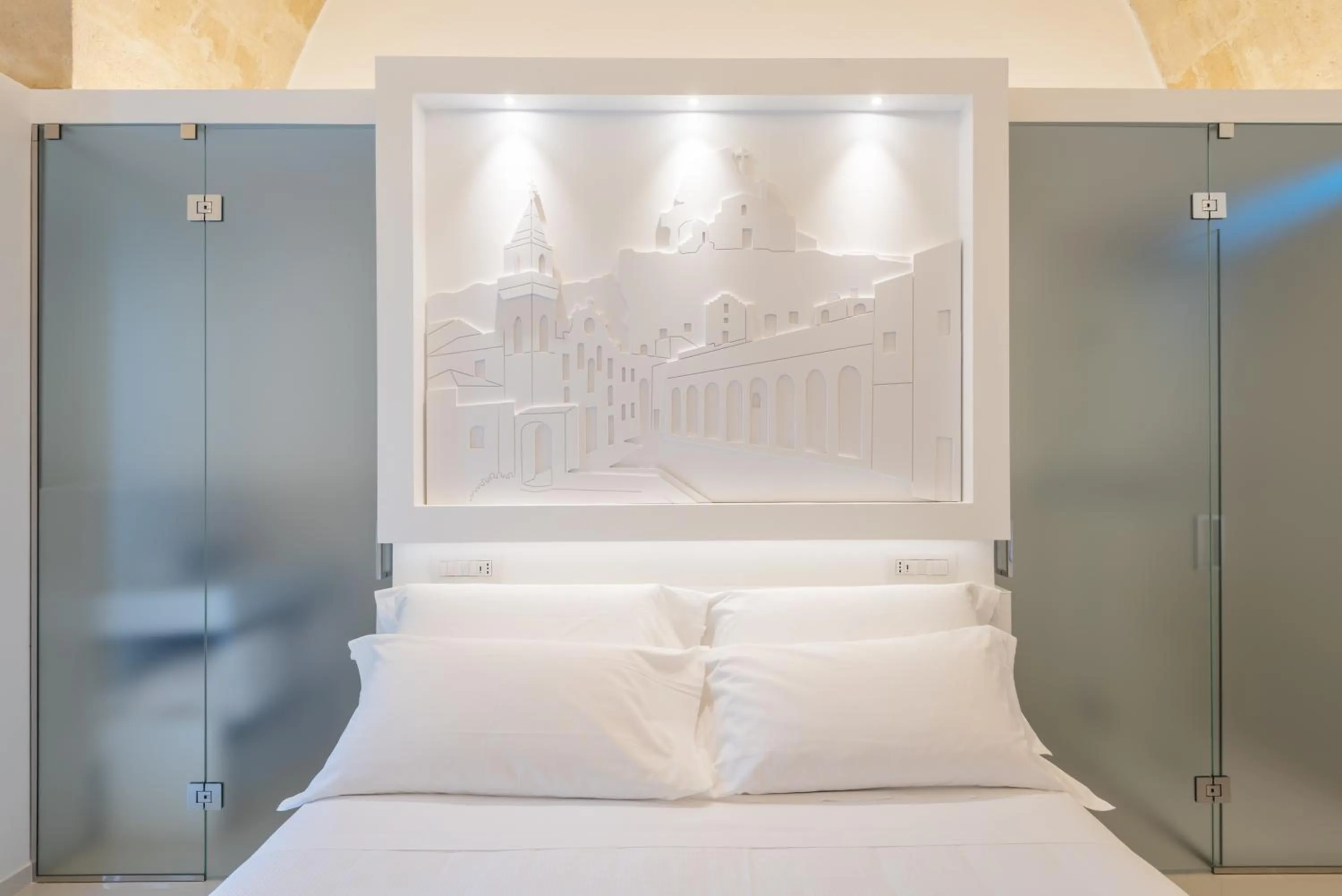 Bed in Vittorio Veneto Matera Luxury Rooms