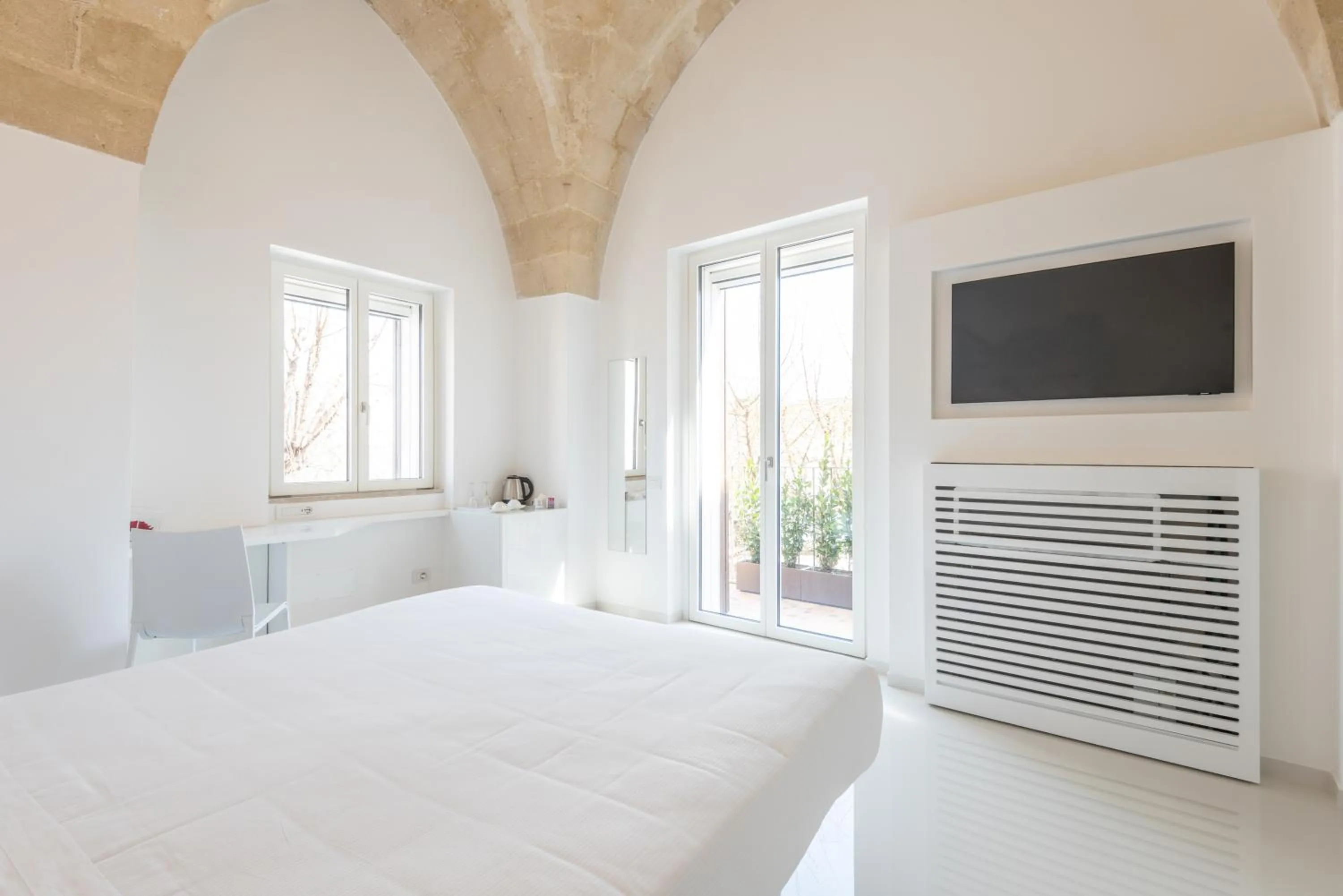 Bed in Vittorio Veneto Matera Luxury Rooms