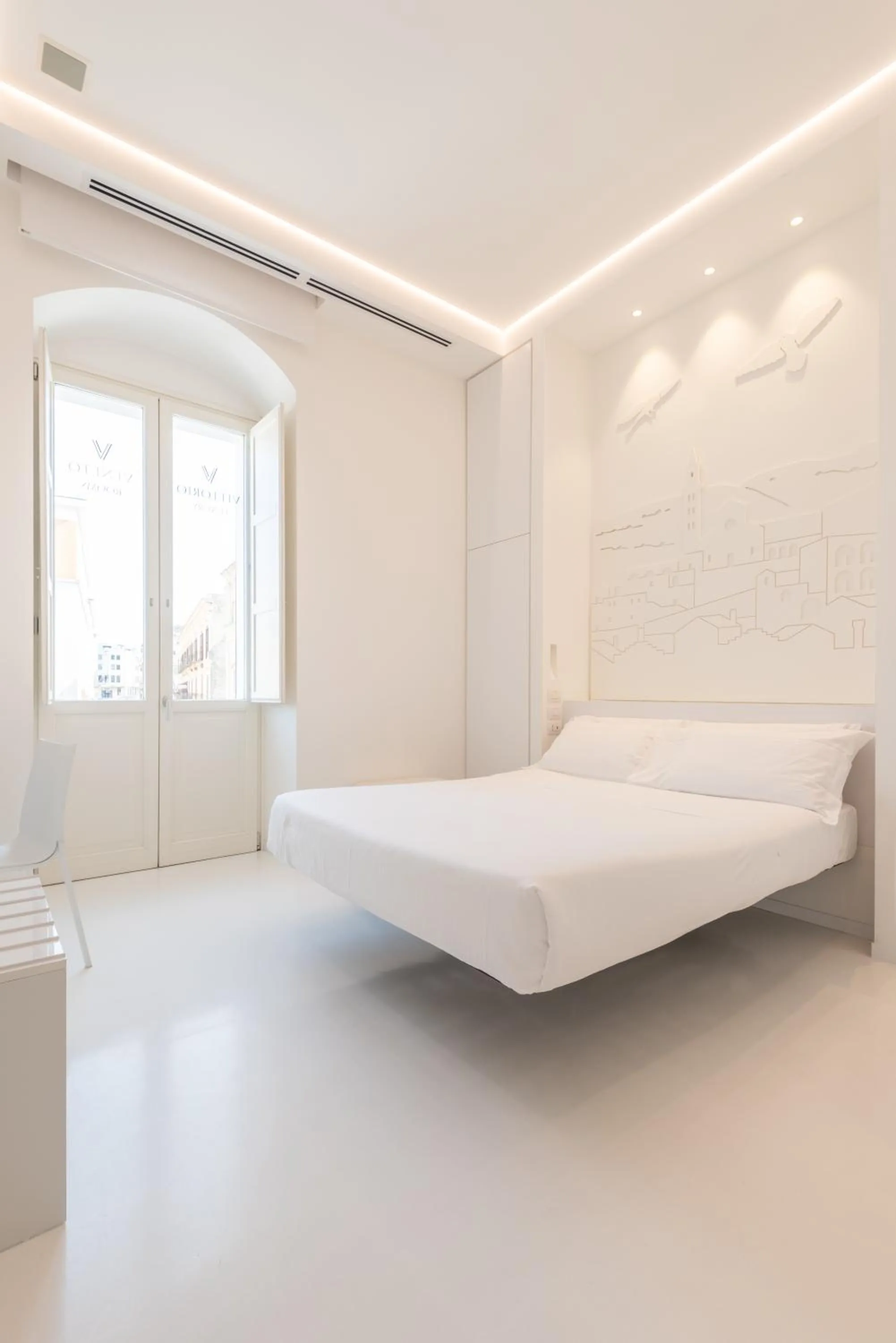 Bed in Vittorio Veneto Matera Luxury Rooms