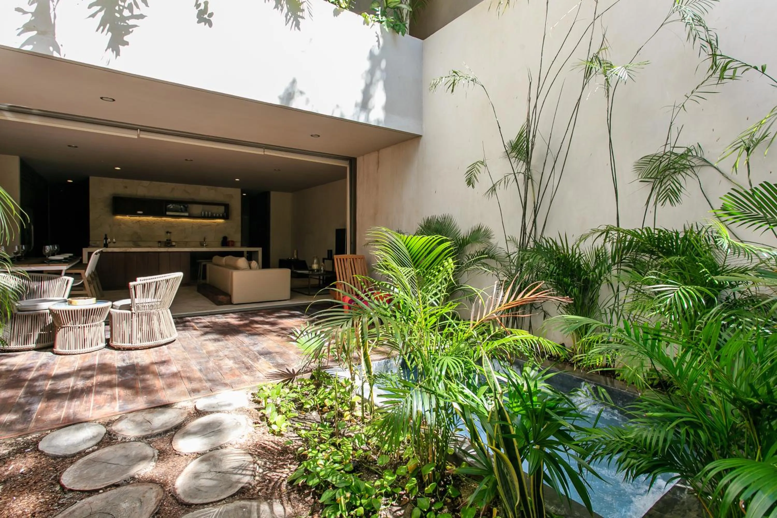 Balcony/Terrace in Eco-chic Design Condos Wrapped in Nature's Elements by Stella Rentals