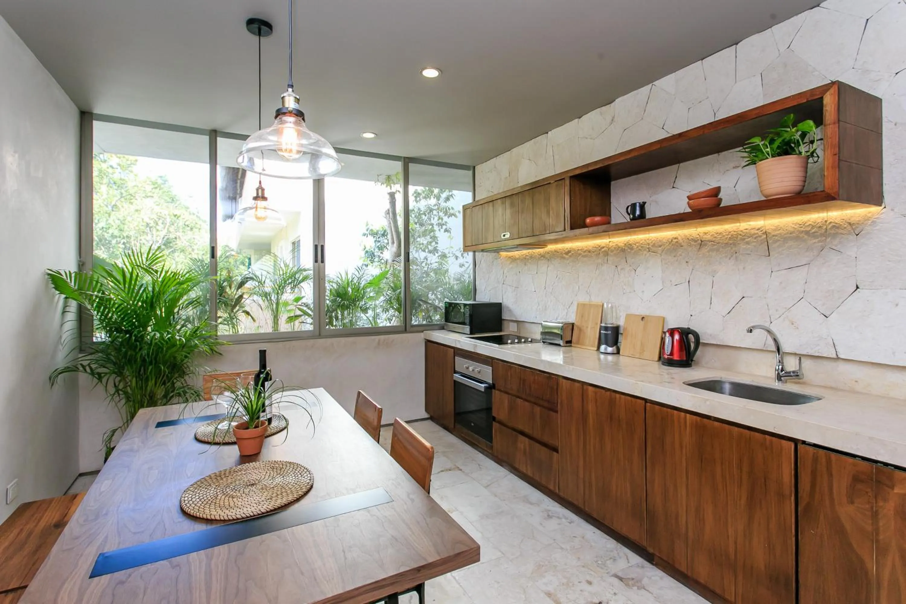 Kitchen or kitchenette in Eco-chic Design Condos Wrapped in Nature's Elements by Stella Rentals