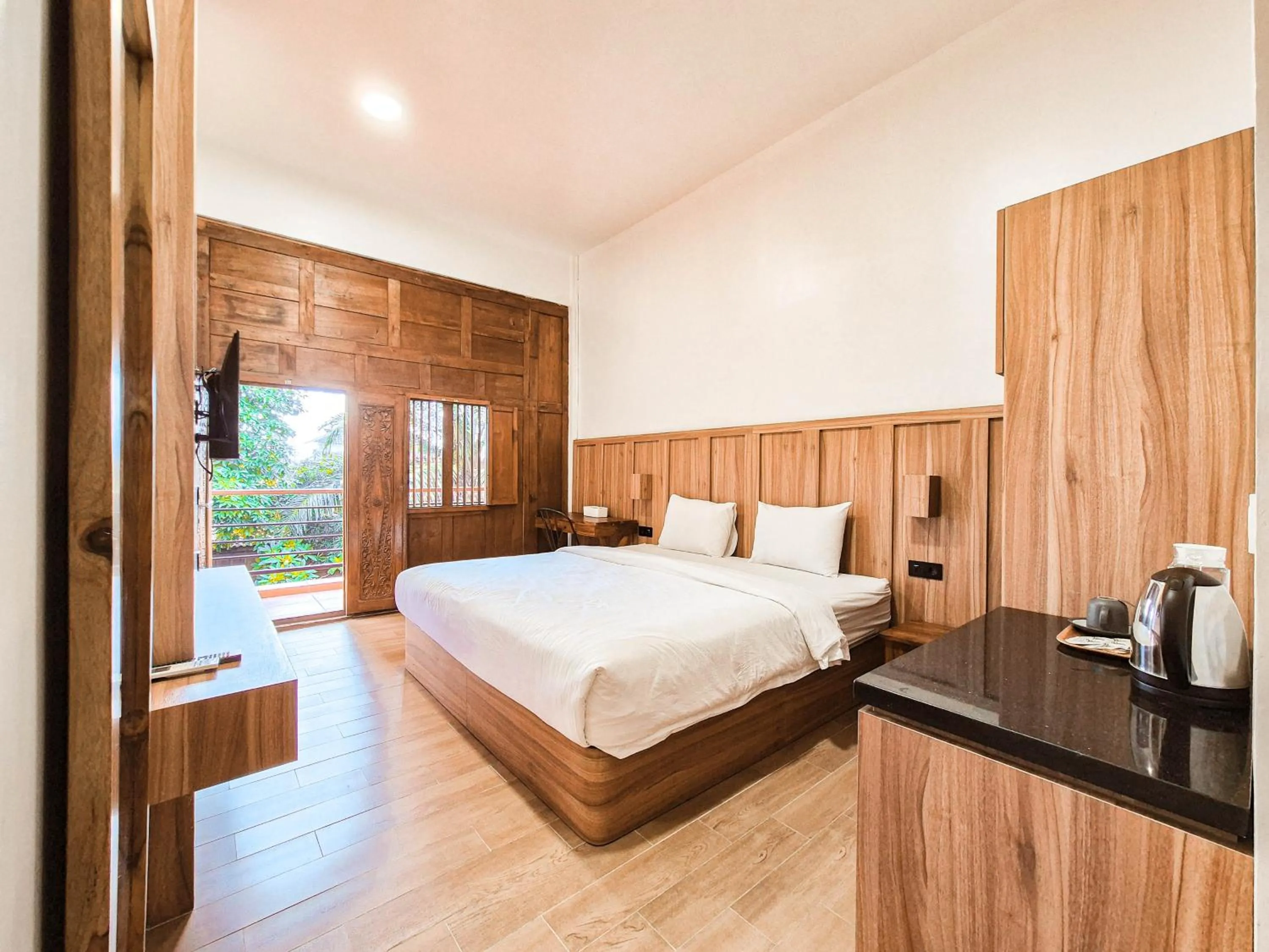 Bed in Pendhapa Art Space - PAS Limasan Homestay