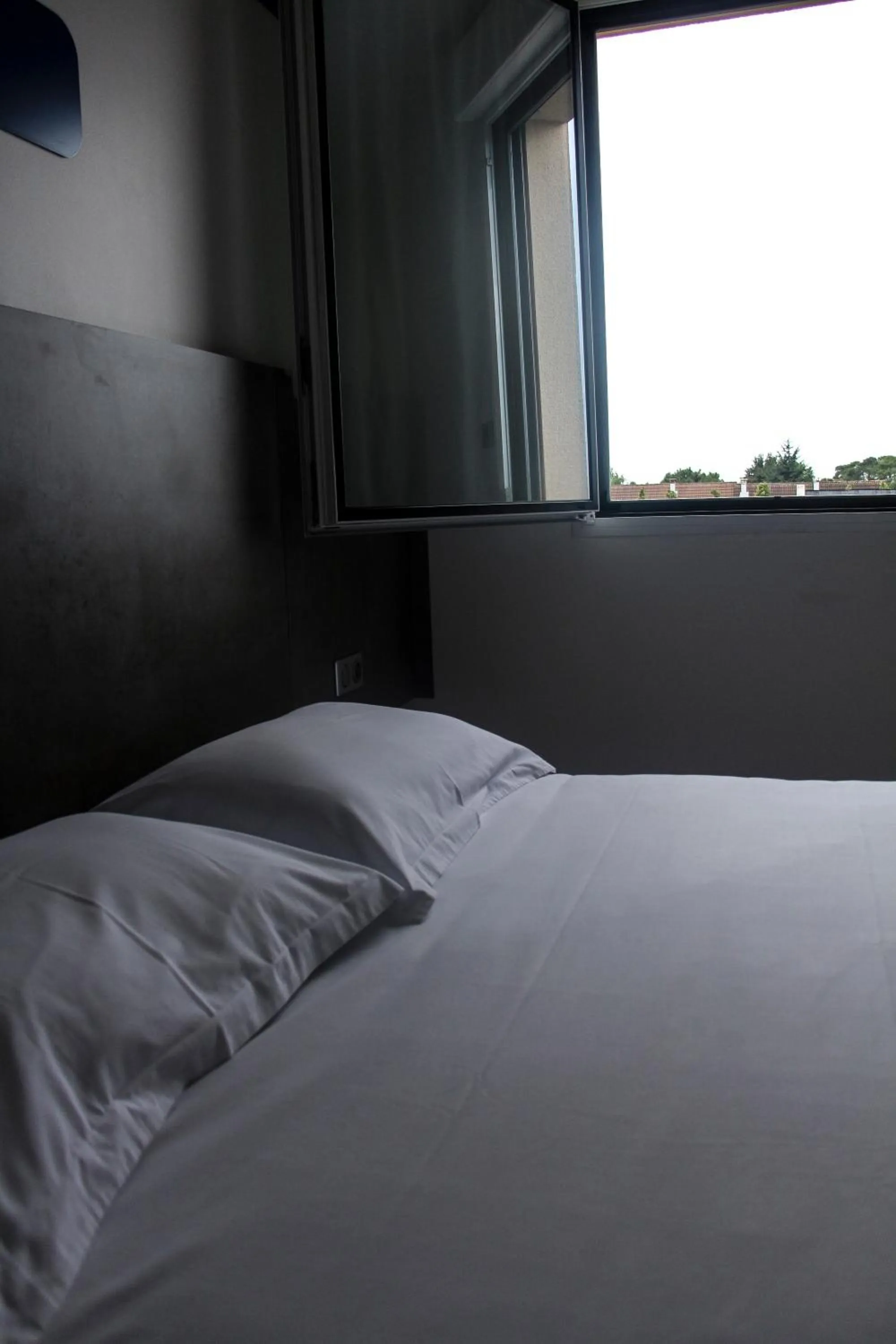 Bed in H24 HOTEL