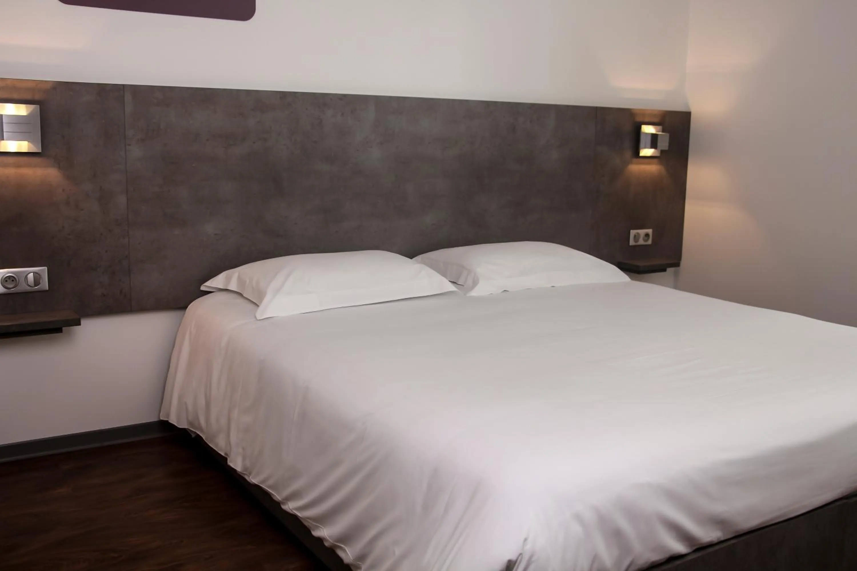 Bed in H24 HOTEL