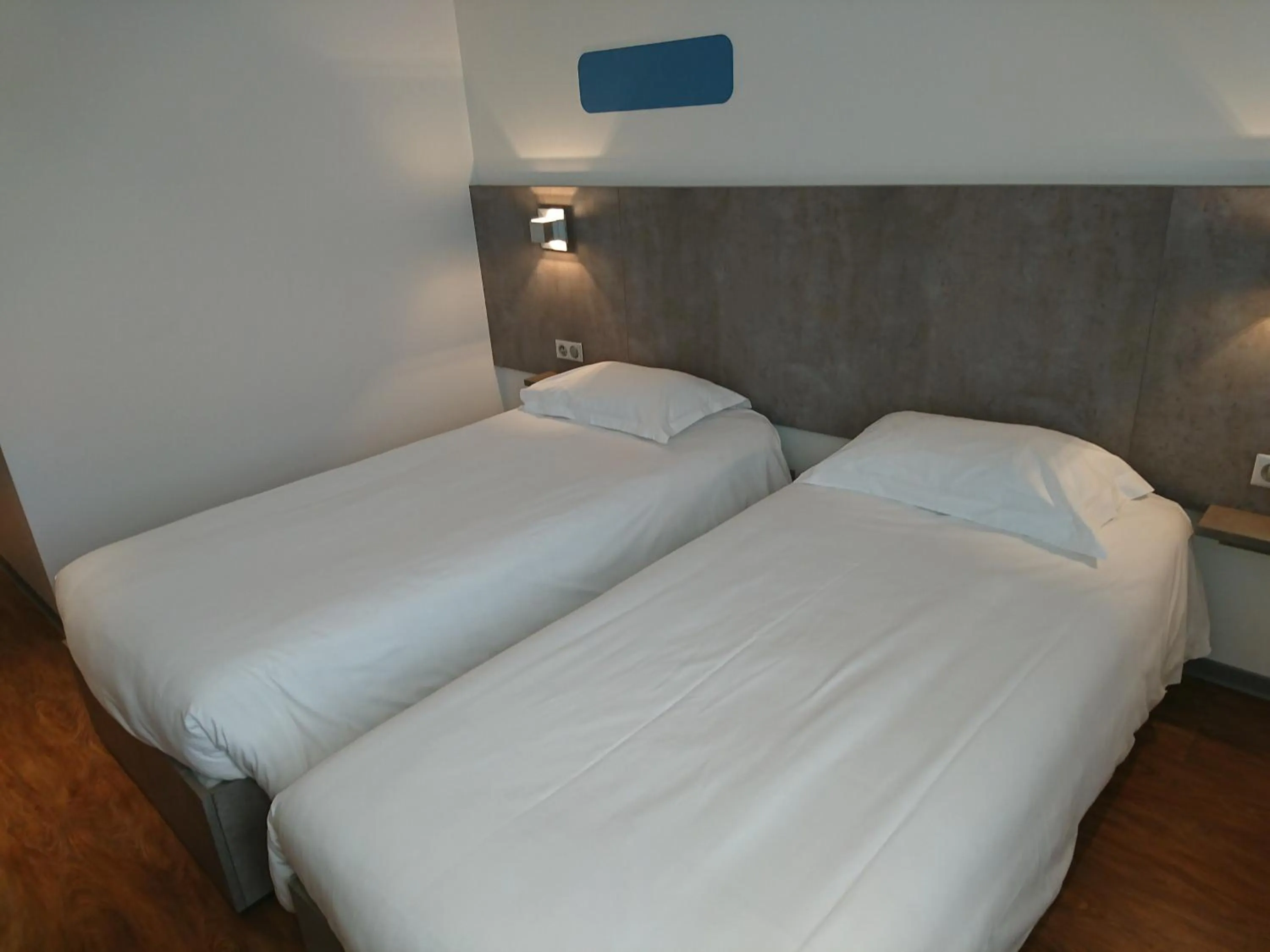 Bed in H24 HOTEL