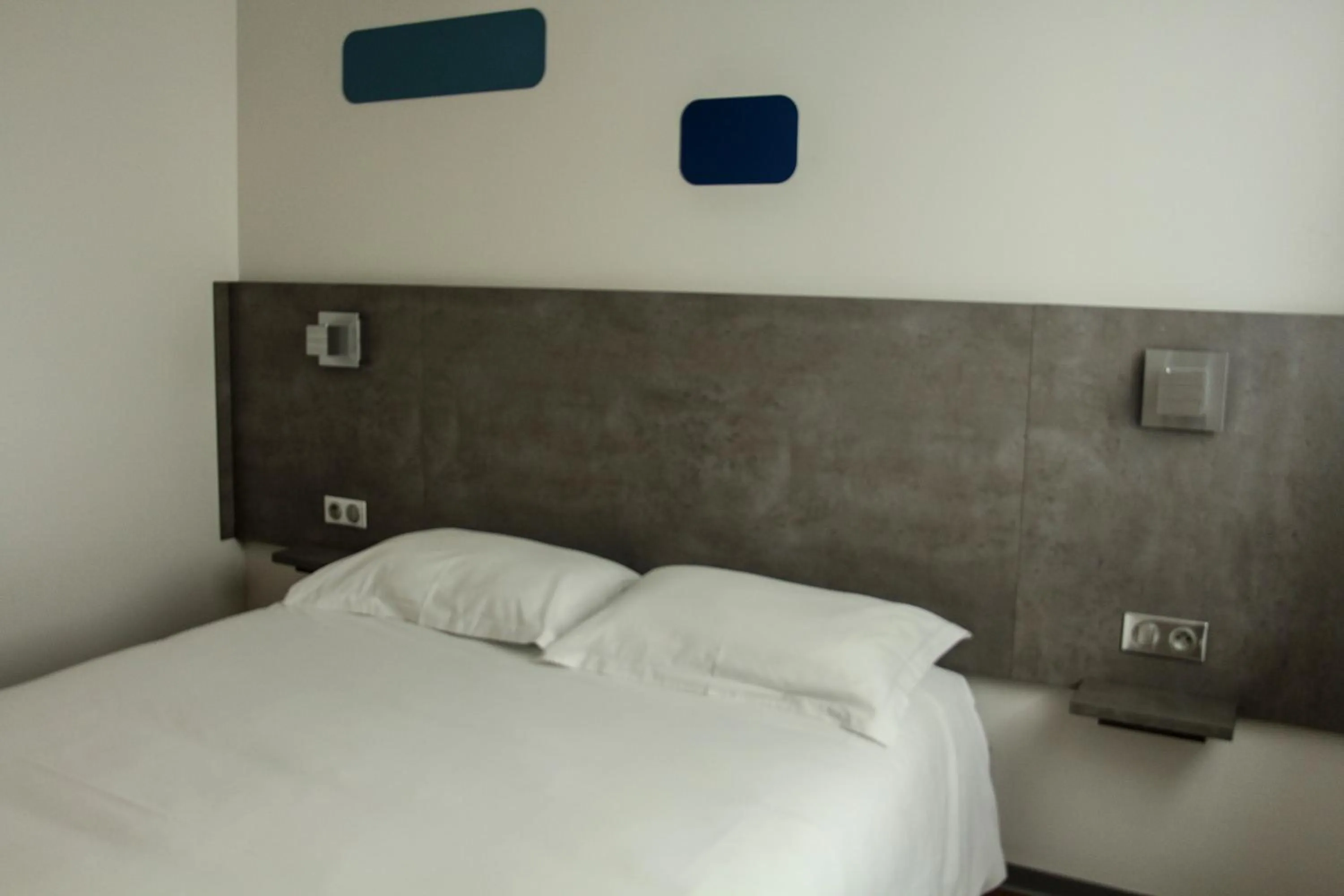 Bed in H24 HOTEL