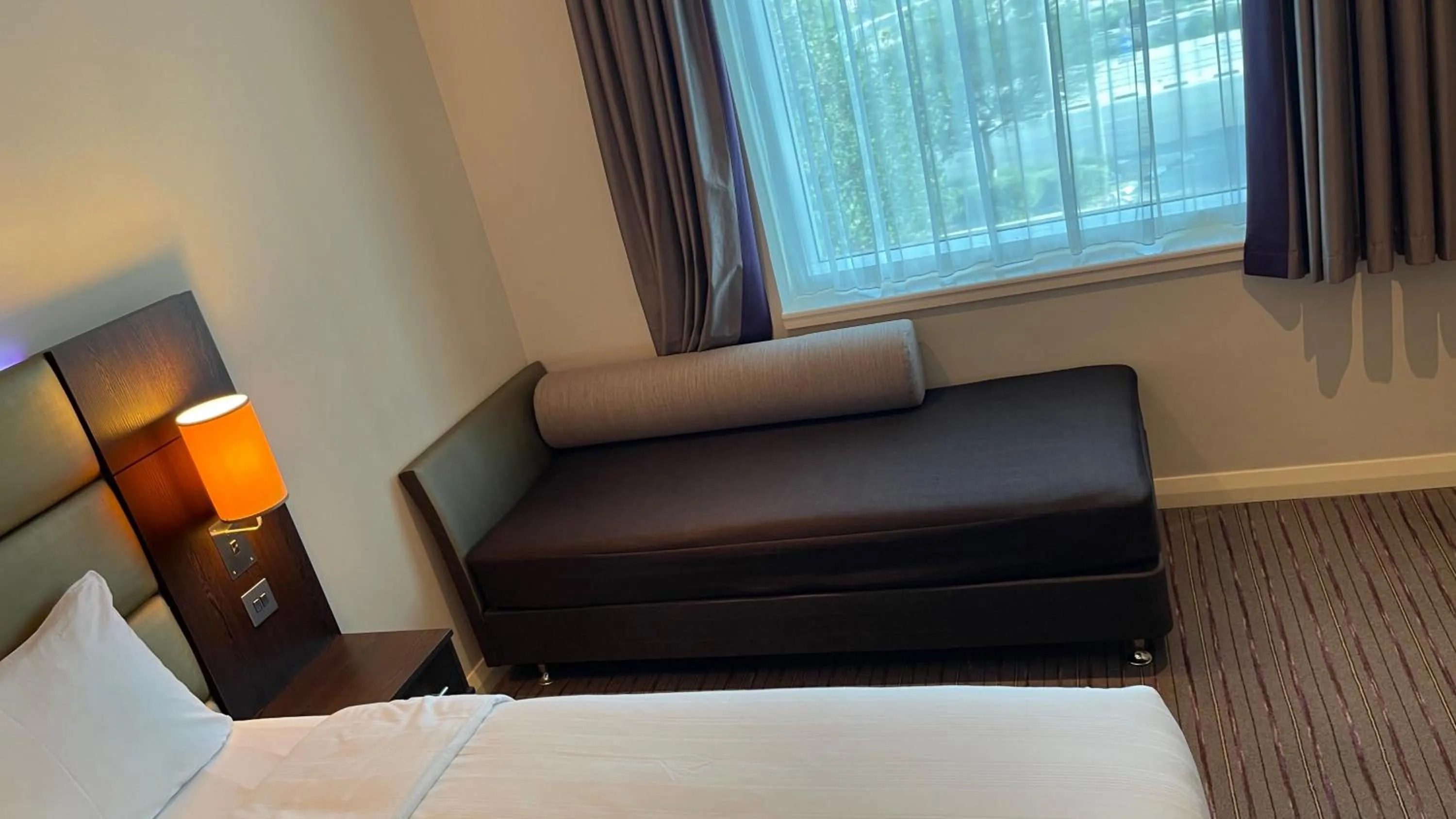 Seating area, Bed in Premier Inn Doha Education City