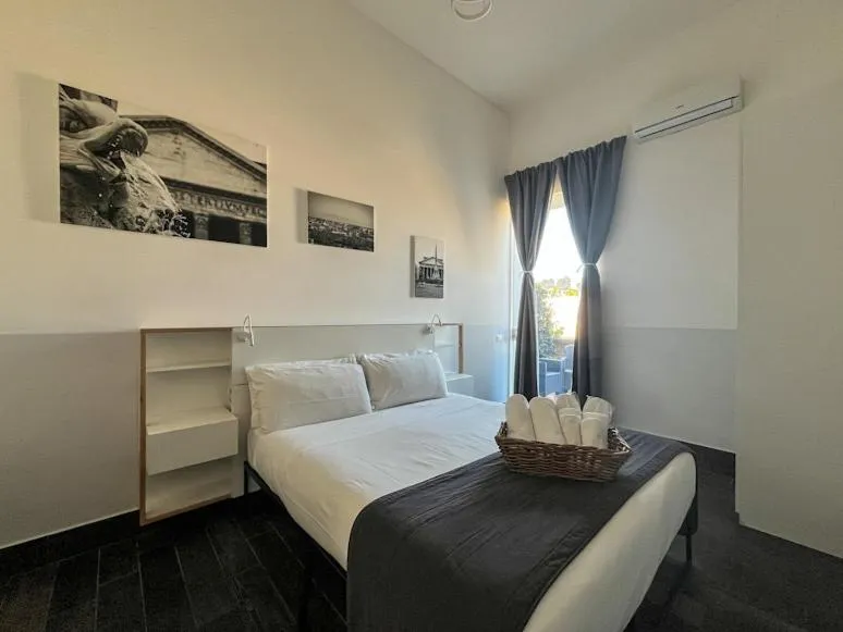 Photo of the whole room, Bed in Arch Rome Suites