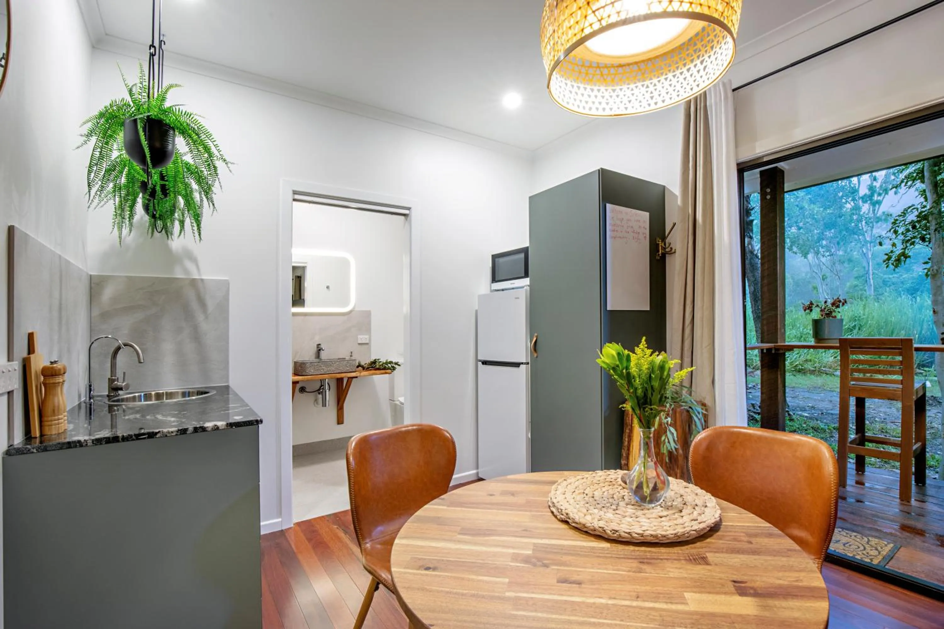 Kitchen or kitchenette in Airlie Beach Eco Cabins - Adults Only