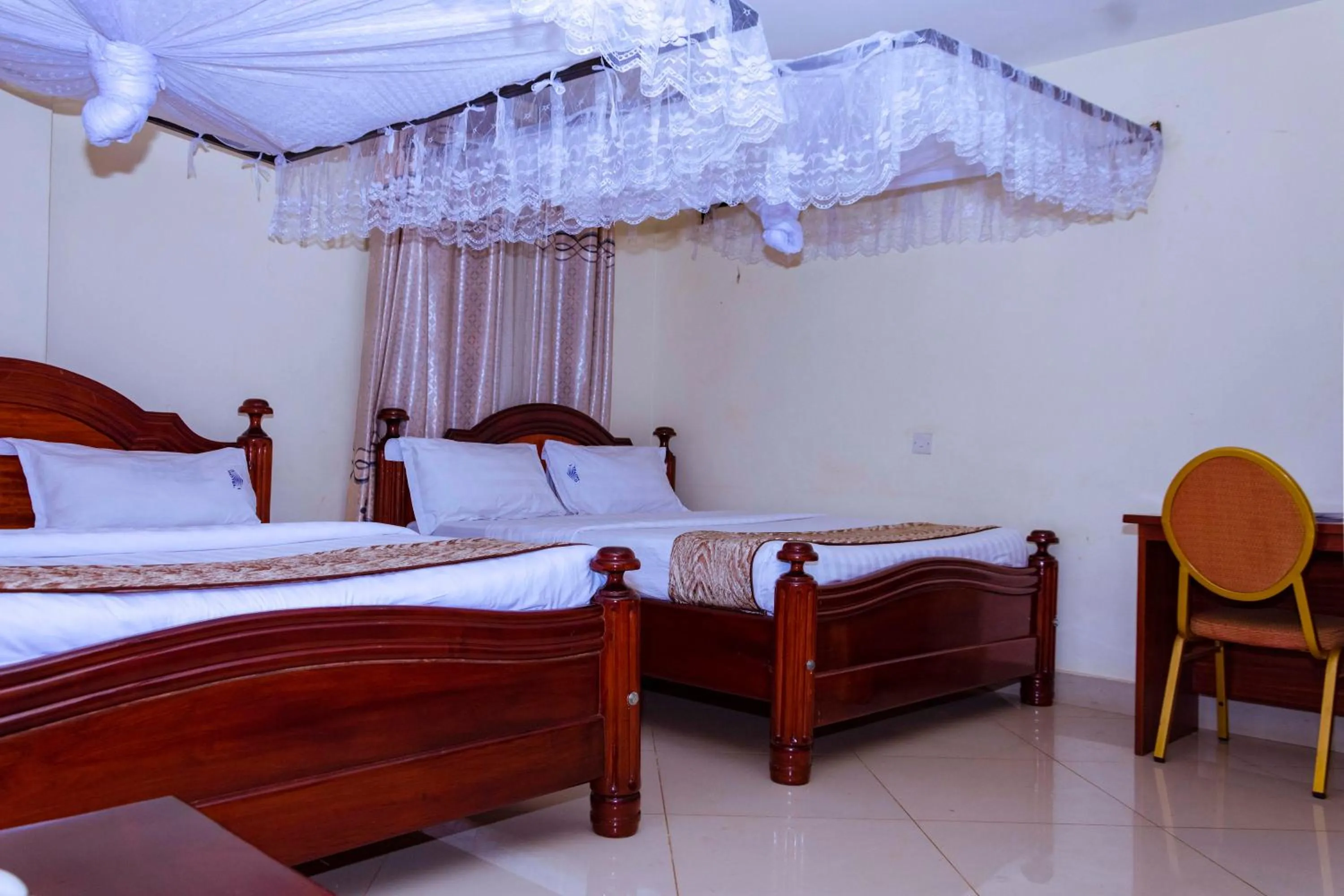Bed in G-One Hotel Kampala