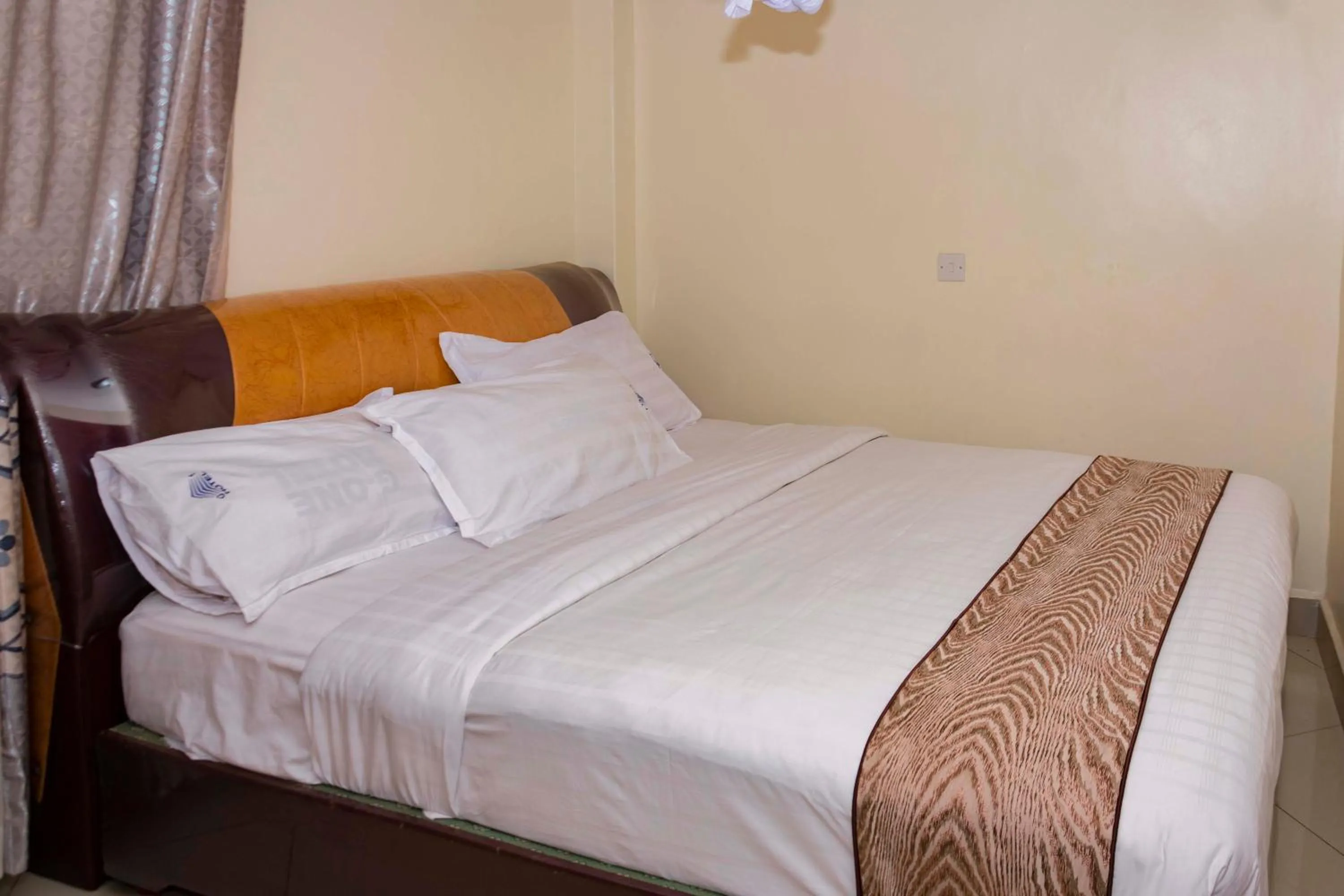 Bed in G-One Hotel Kampala