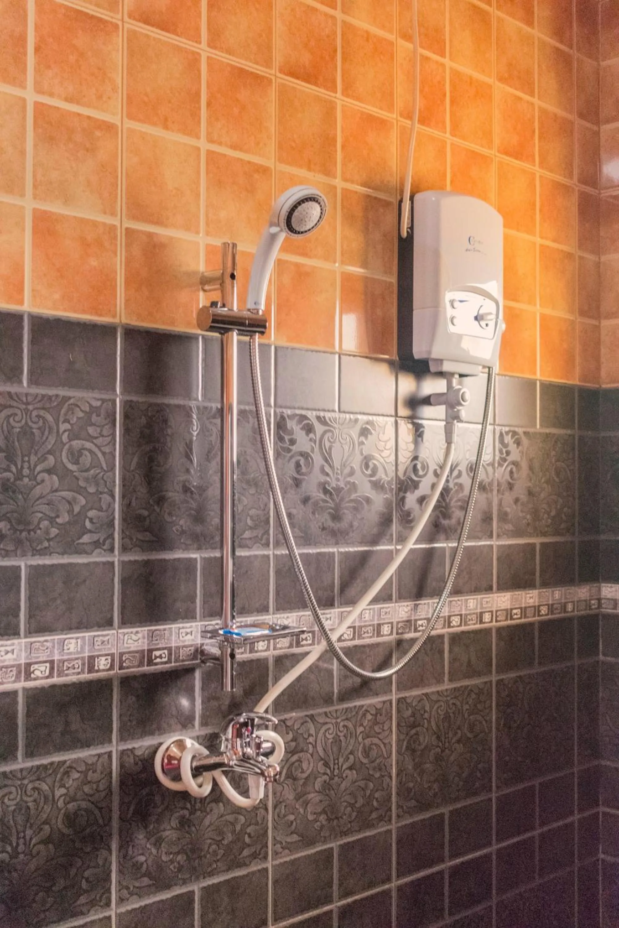 Shower in Olina Hotel and Apartments Kampala