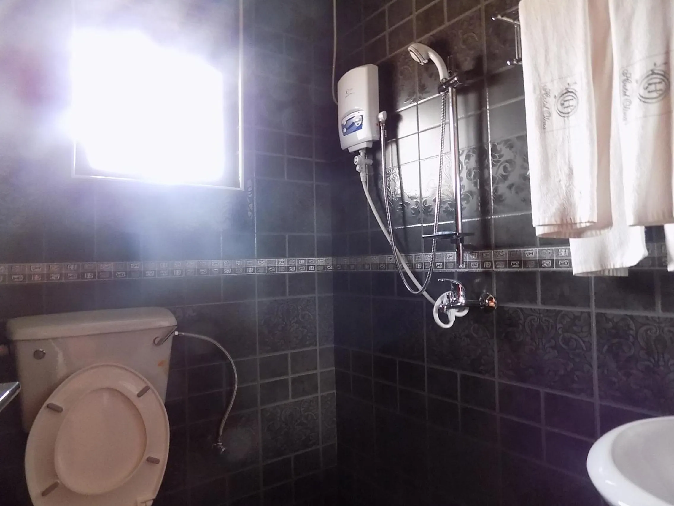 Bathroom in Olina Hotel and Apartments Kampala