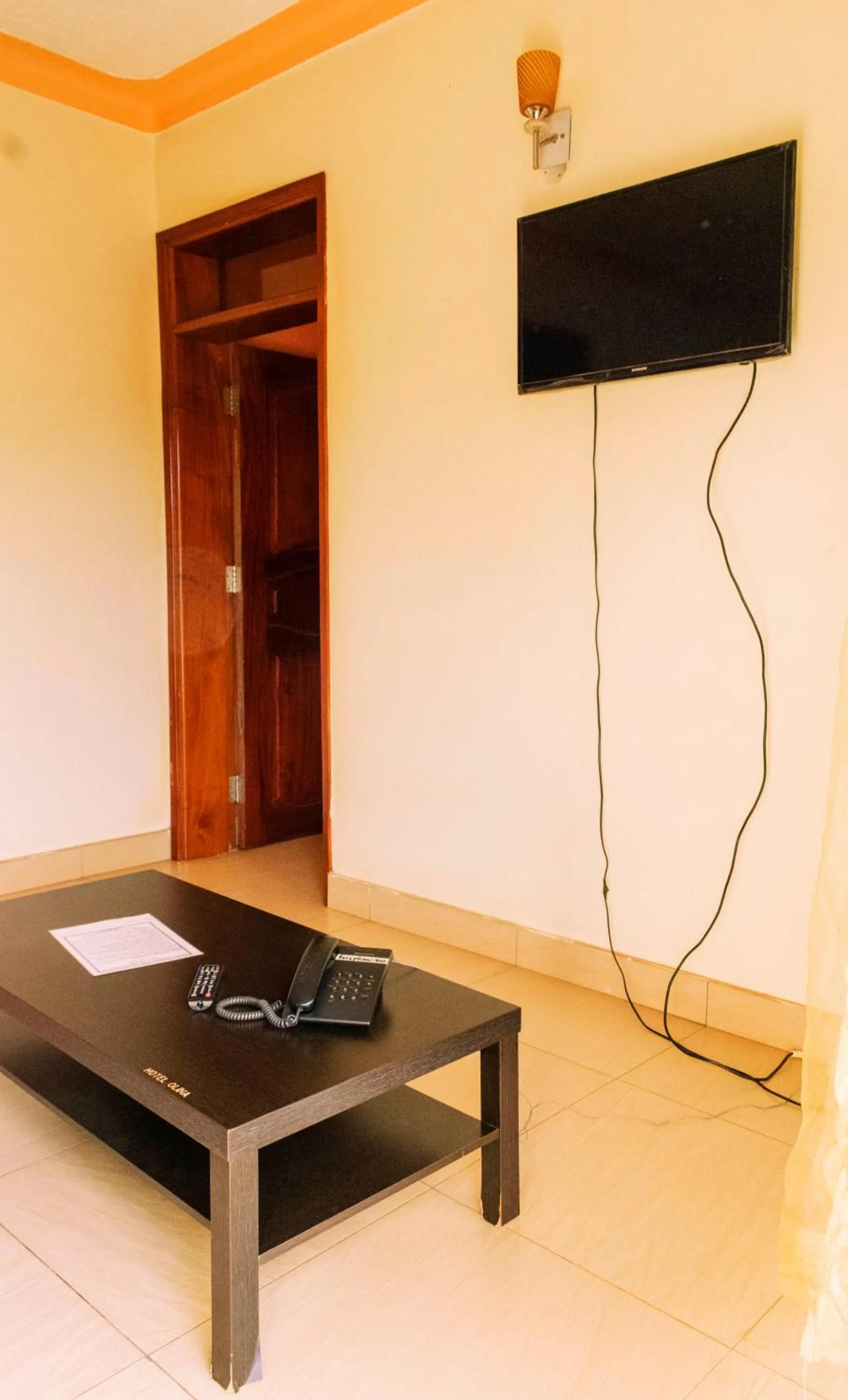 Communal lounge/ TV room in Olina Hotel and Apartments Kampala