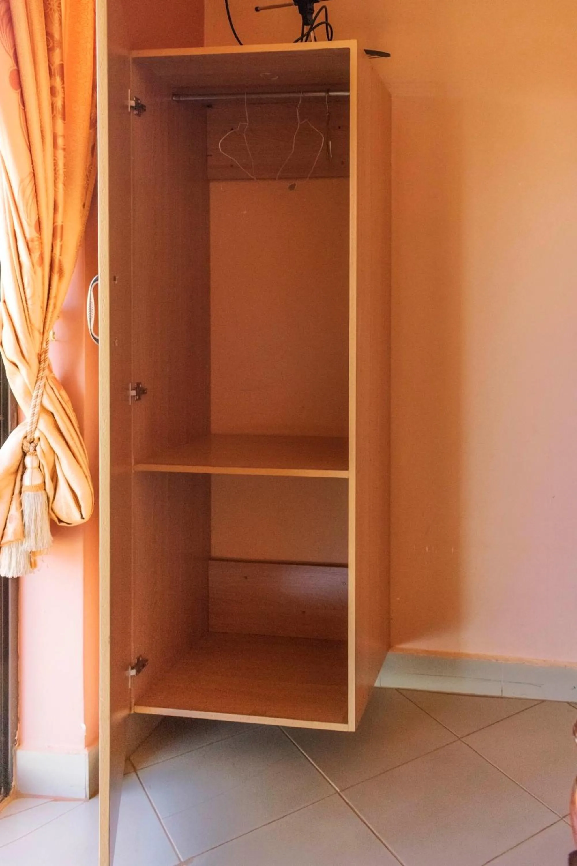 wardrobe in Olina Hotel and Apartments Kampala